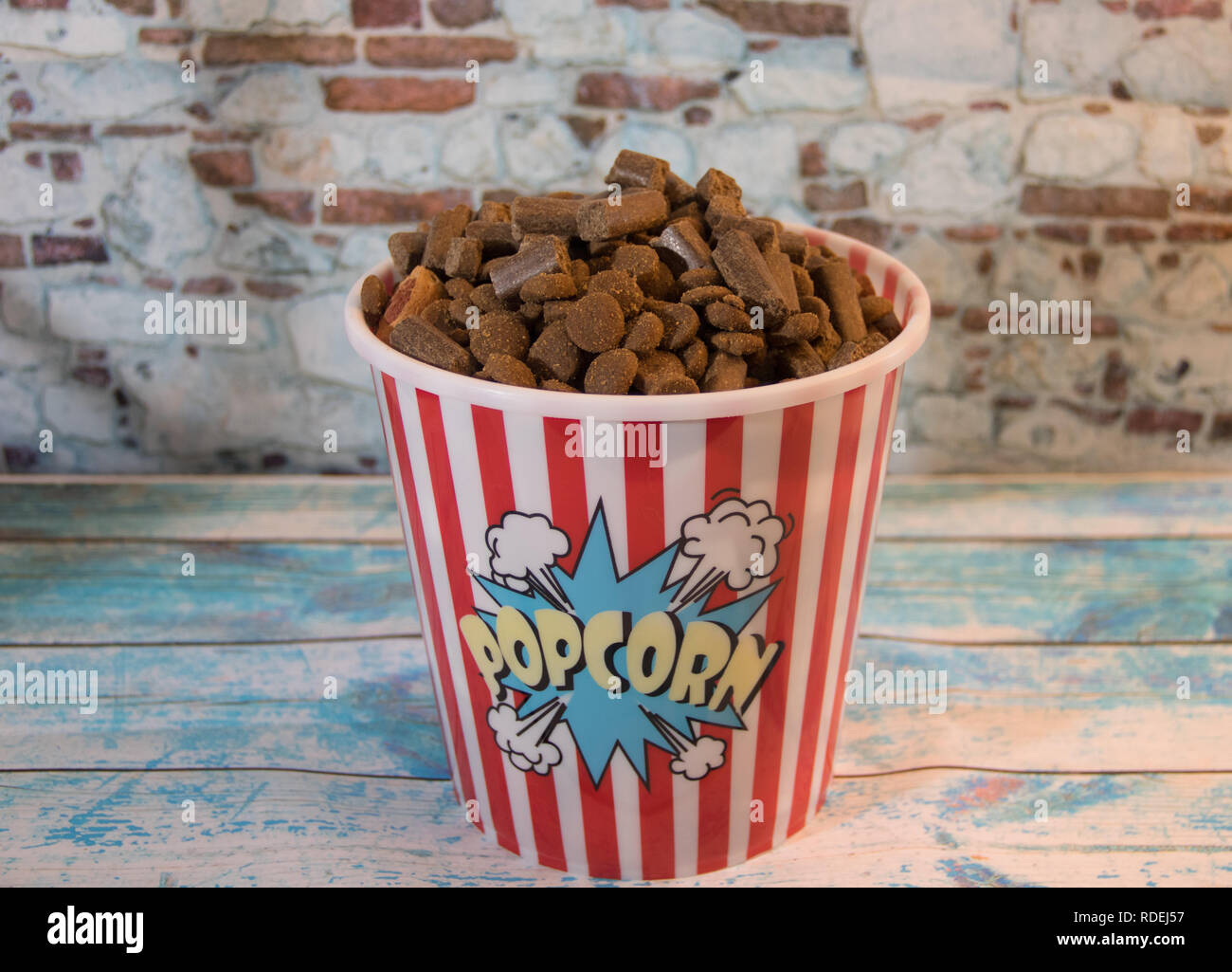 dog prizes in a container of popcorn Stock Photo