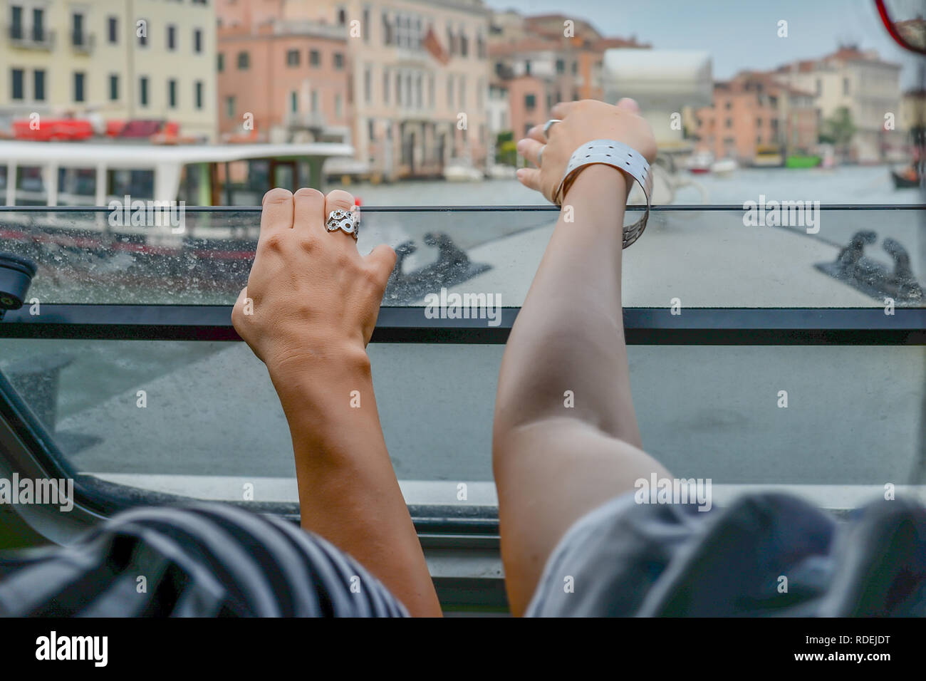 two girls watch Venice from the boat Stock Photo
