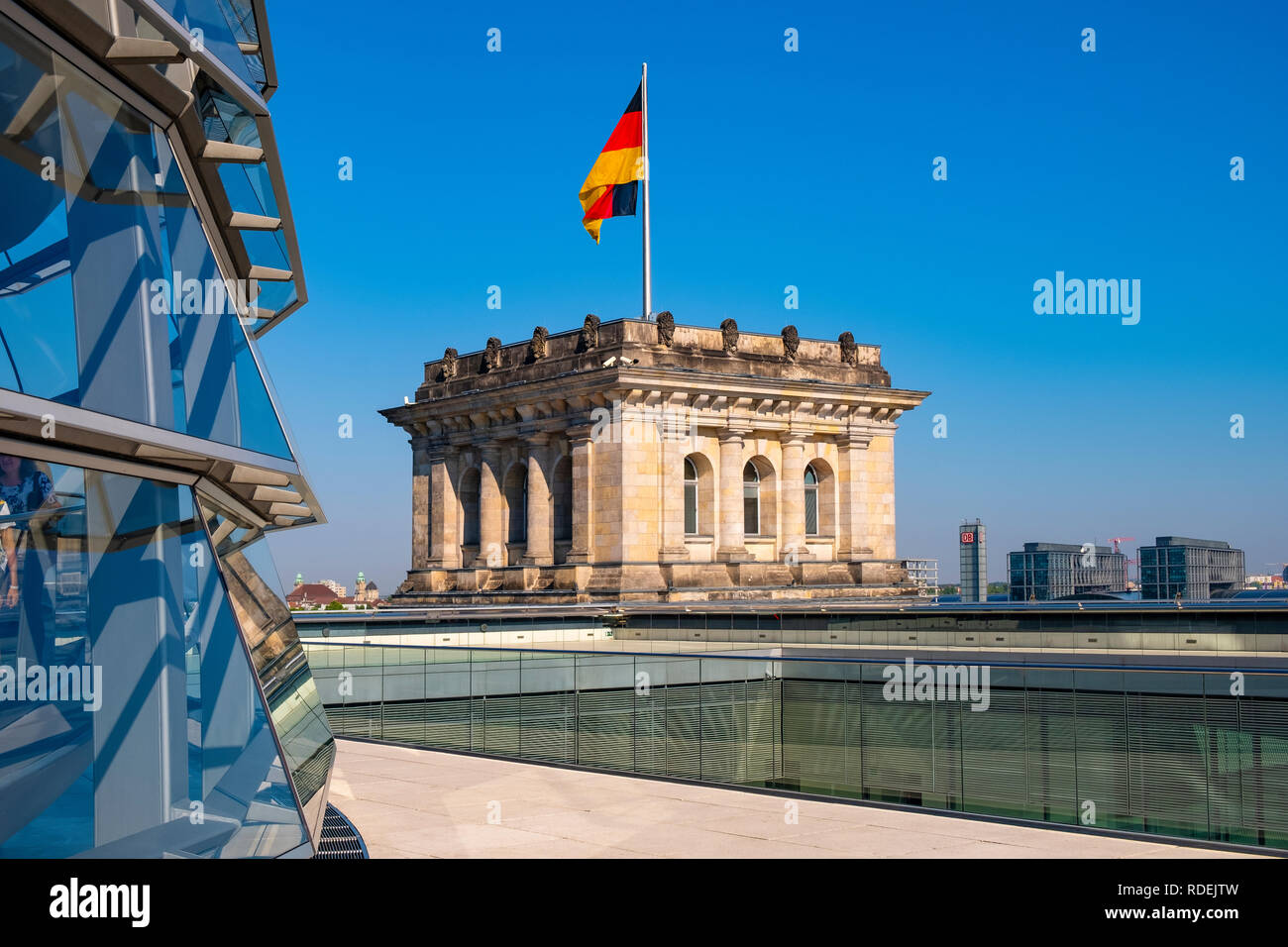 Berlin, Berlin state / Germany - 2018/07/31: Rooftop of the Reichstag building with the glass panoramic Bundestag dome and historic corner tower Stock Photo