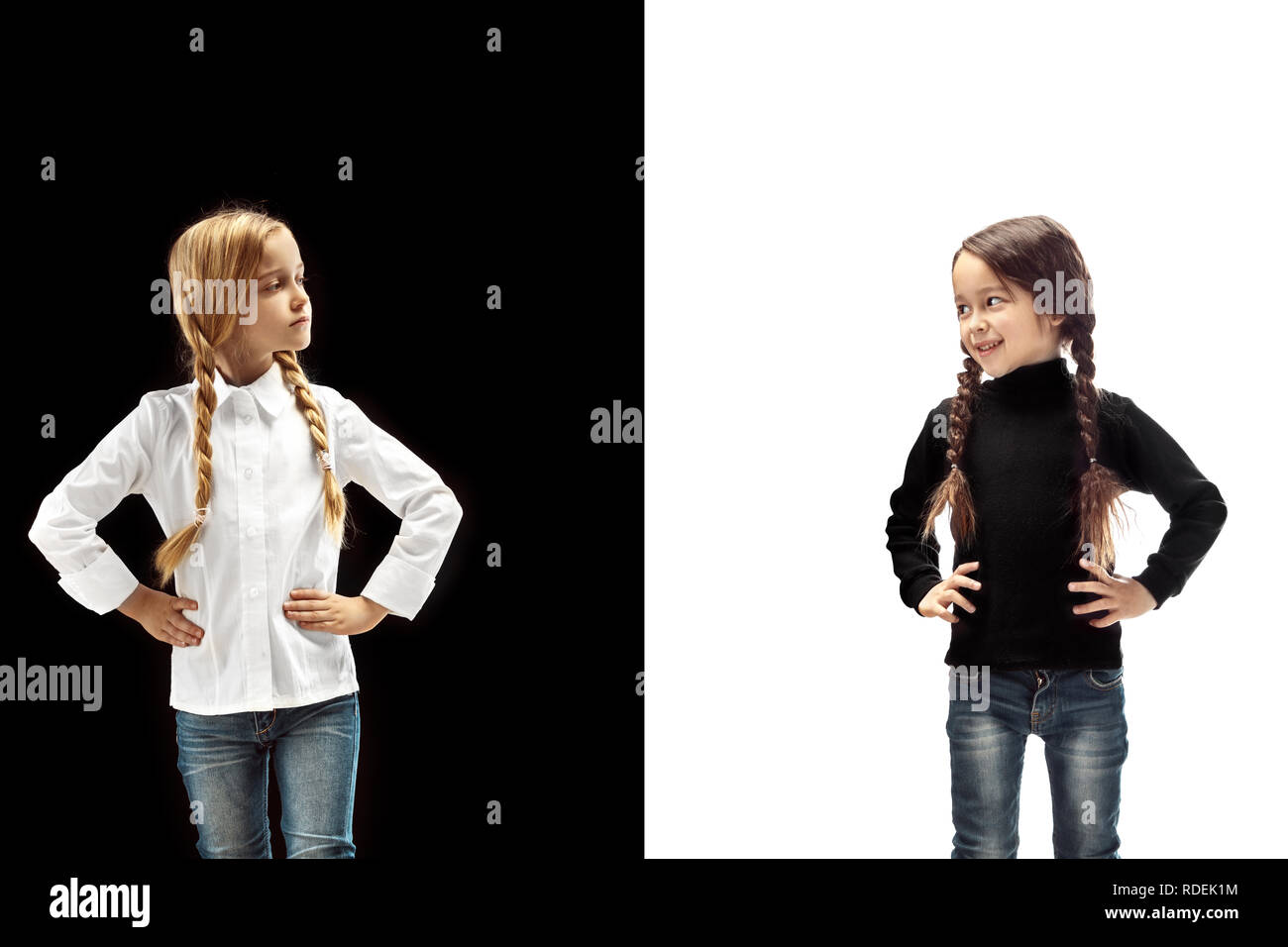 The portrait of two emotional happy girl and sad serious girl on a ...