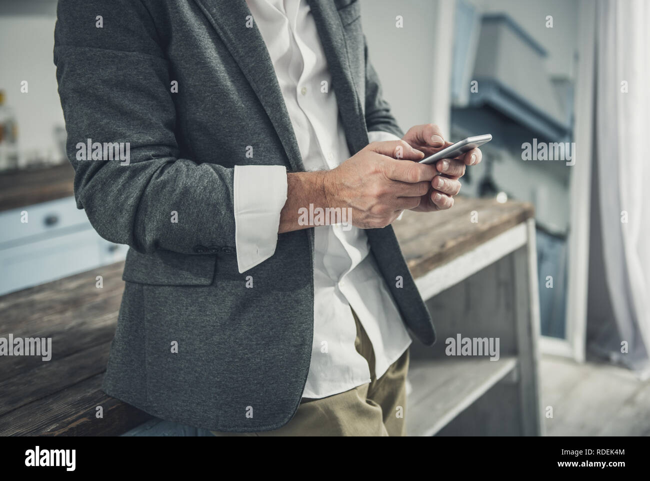 White collar worker typing message for his partner Stock Photo