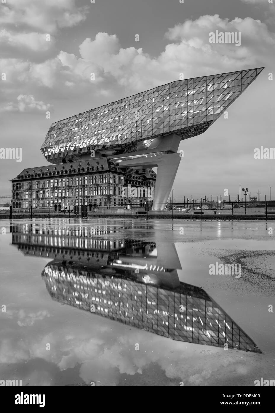 Antwerp Port headquarters. Zaha Hadid Architects added a glass extension to a renovated fire station. Stock Photo