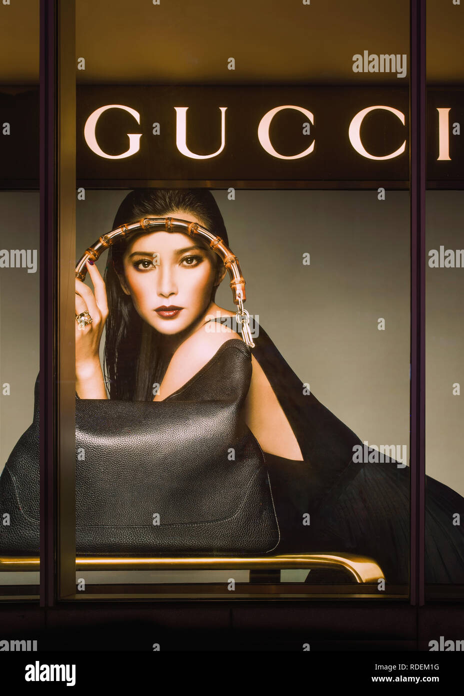 Window of a Gucci outlet. The luxury sales will grow 20%-22% in mainland China in 2018, doubling the rate of growth seen anywhere else Photo - Alamy