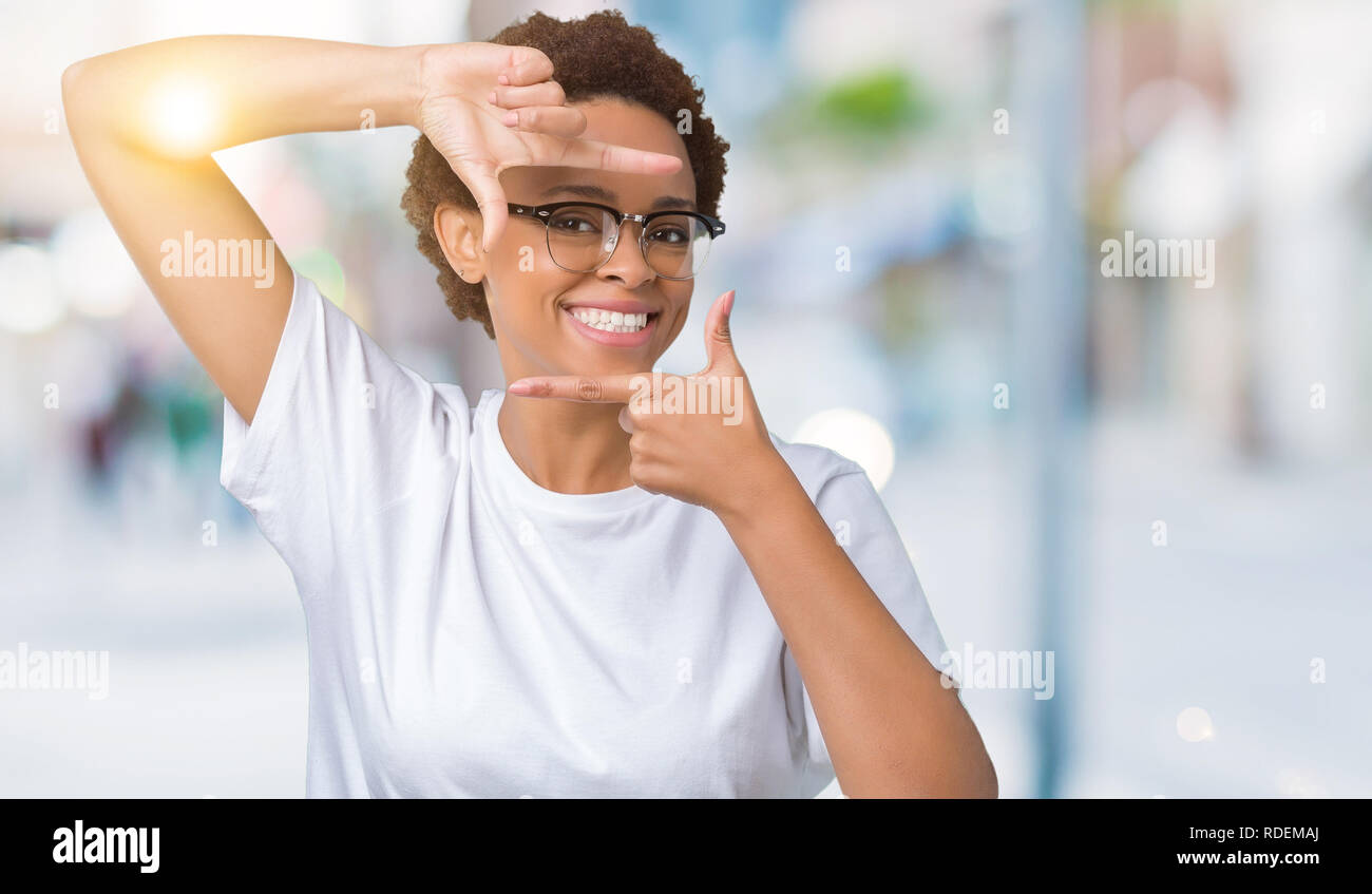 Beautiful young african american woman wearing glasses over isolated ...