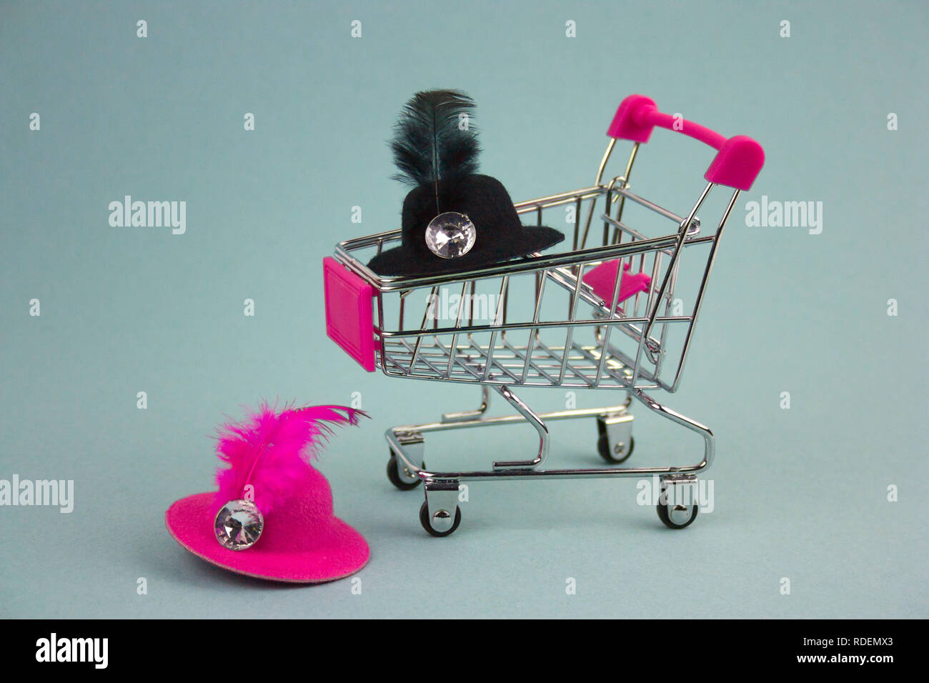 shopping cart with pink and black hats Stock Photo