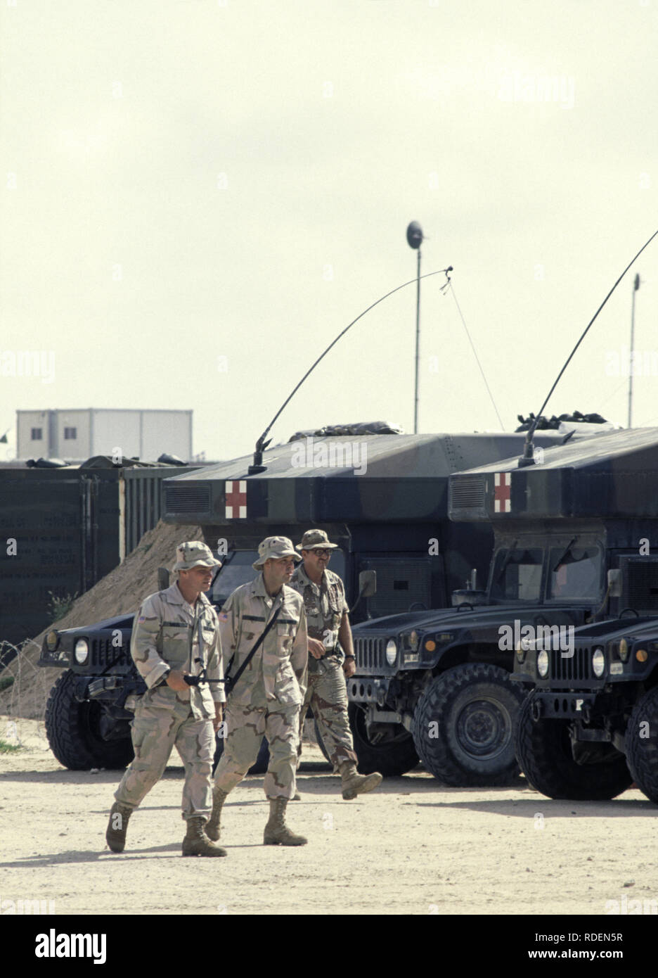 12th October 1993 U.S. Army soldiers walk past parked Humvee ambulance ...