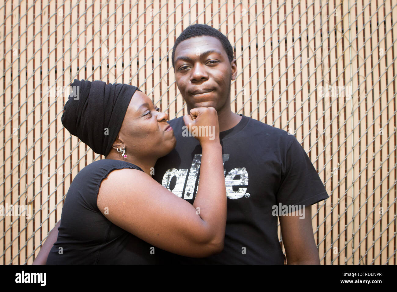 Black mom and teenager son having conversation about love and life Stock Photo