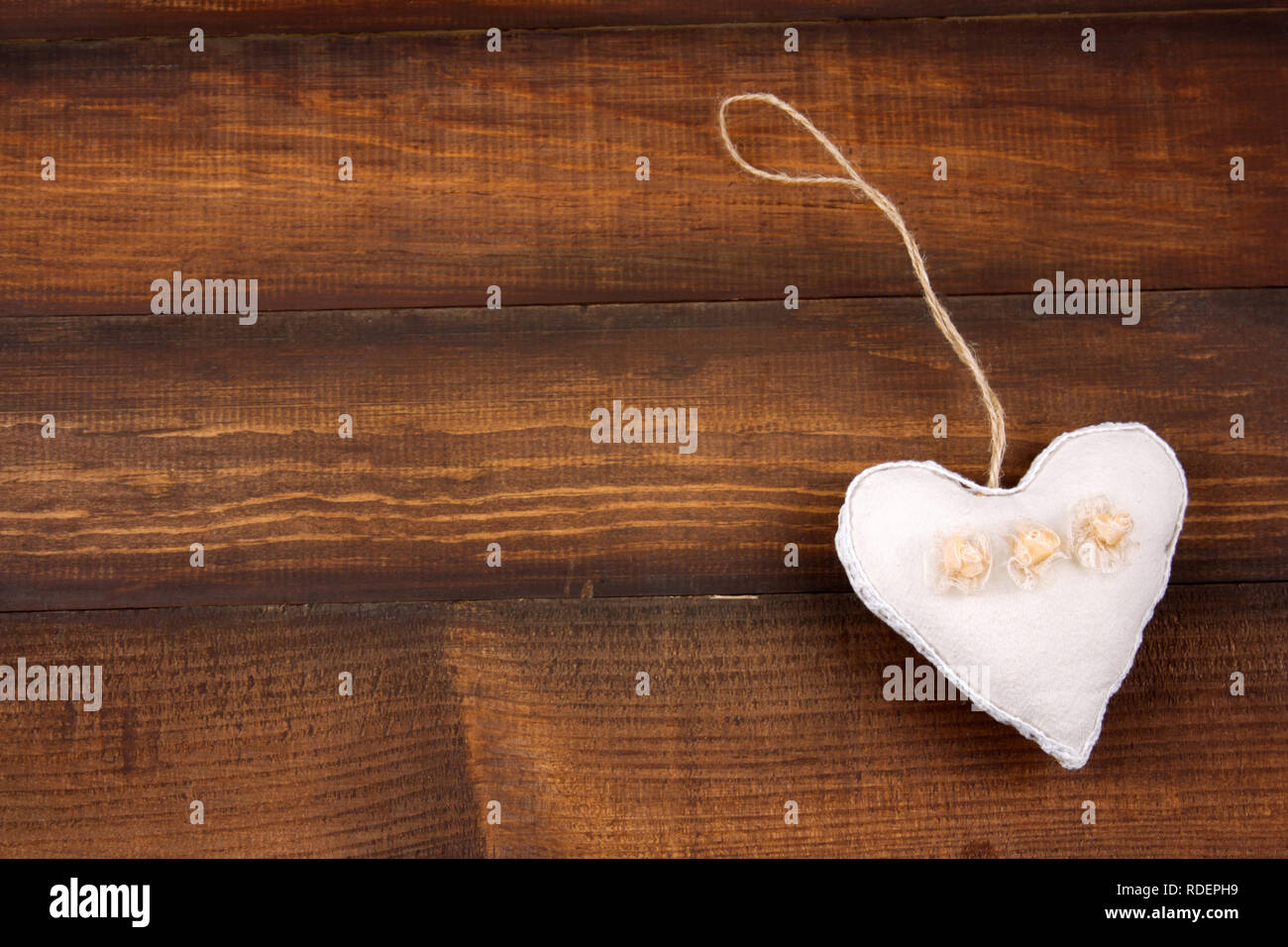 top view soft toy in a shape of heart on a wooden background copy space Stock Photo