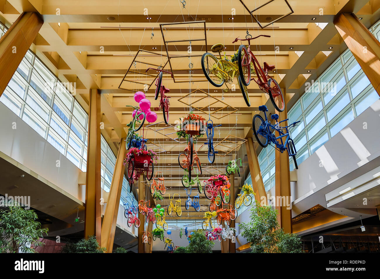 Many colorful bicycles hanging from the ceiling of the Aria Resort & Casino in Las Vegas, Nevada, USA Stock Photo