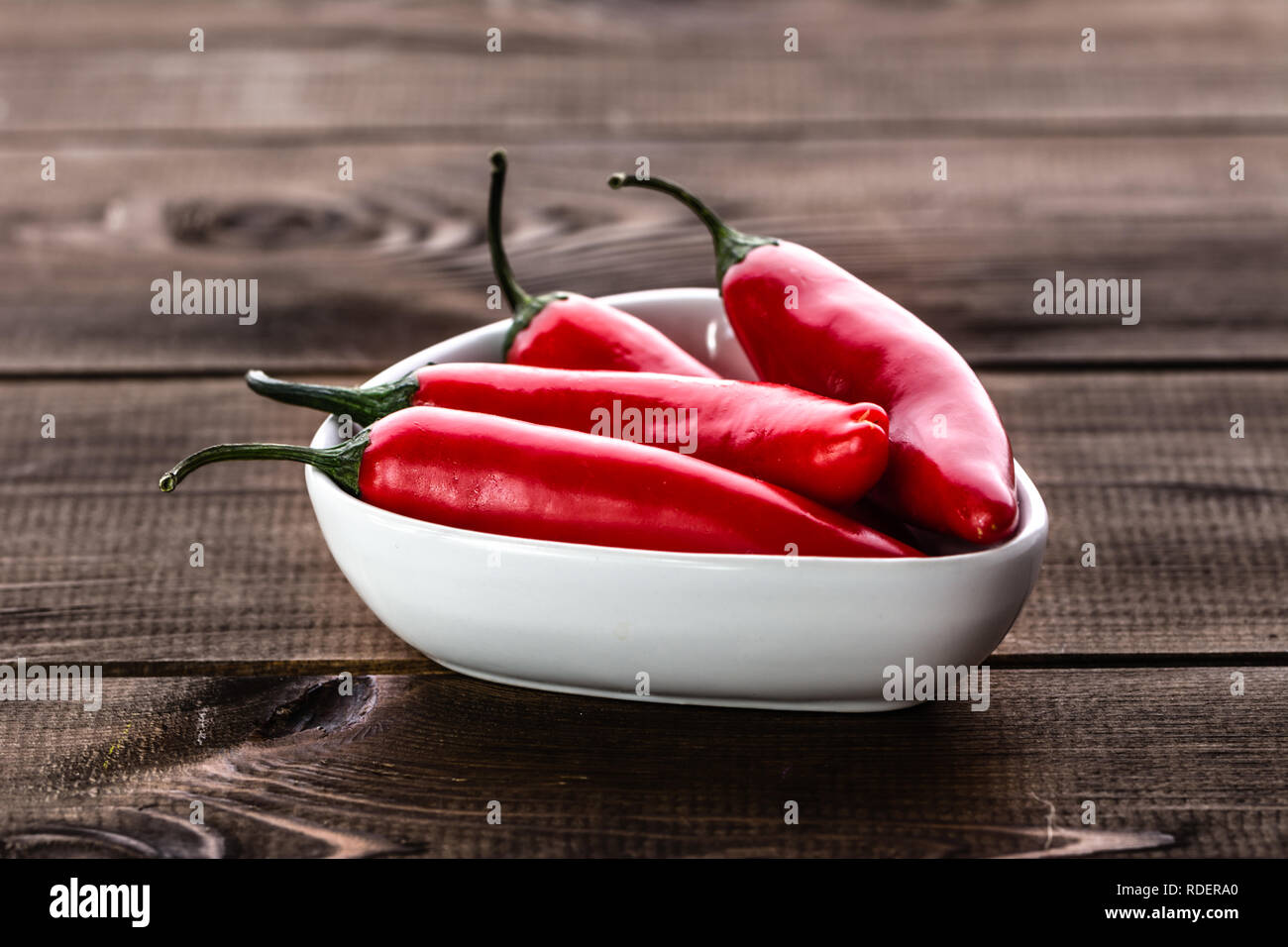 Red hot chili pepper or spicy chilli cayenne pepper, spice from mexican cuisine Stock Photo