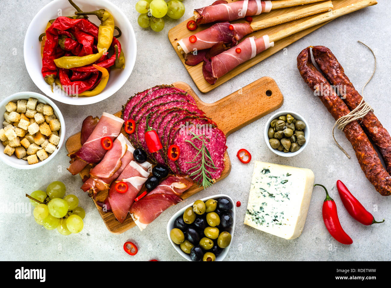 Traditional spanish tapas on table, food selection, cold meat, sausage