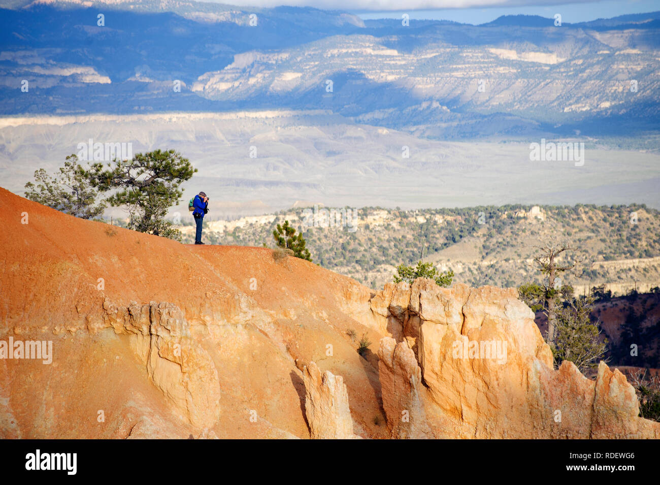 Hiker taking a picture at Bryce Canyon National Park, Utah, USA. Stock Photo