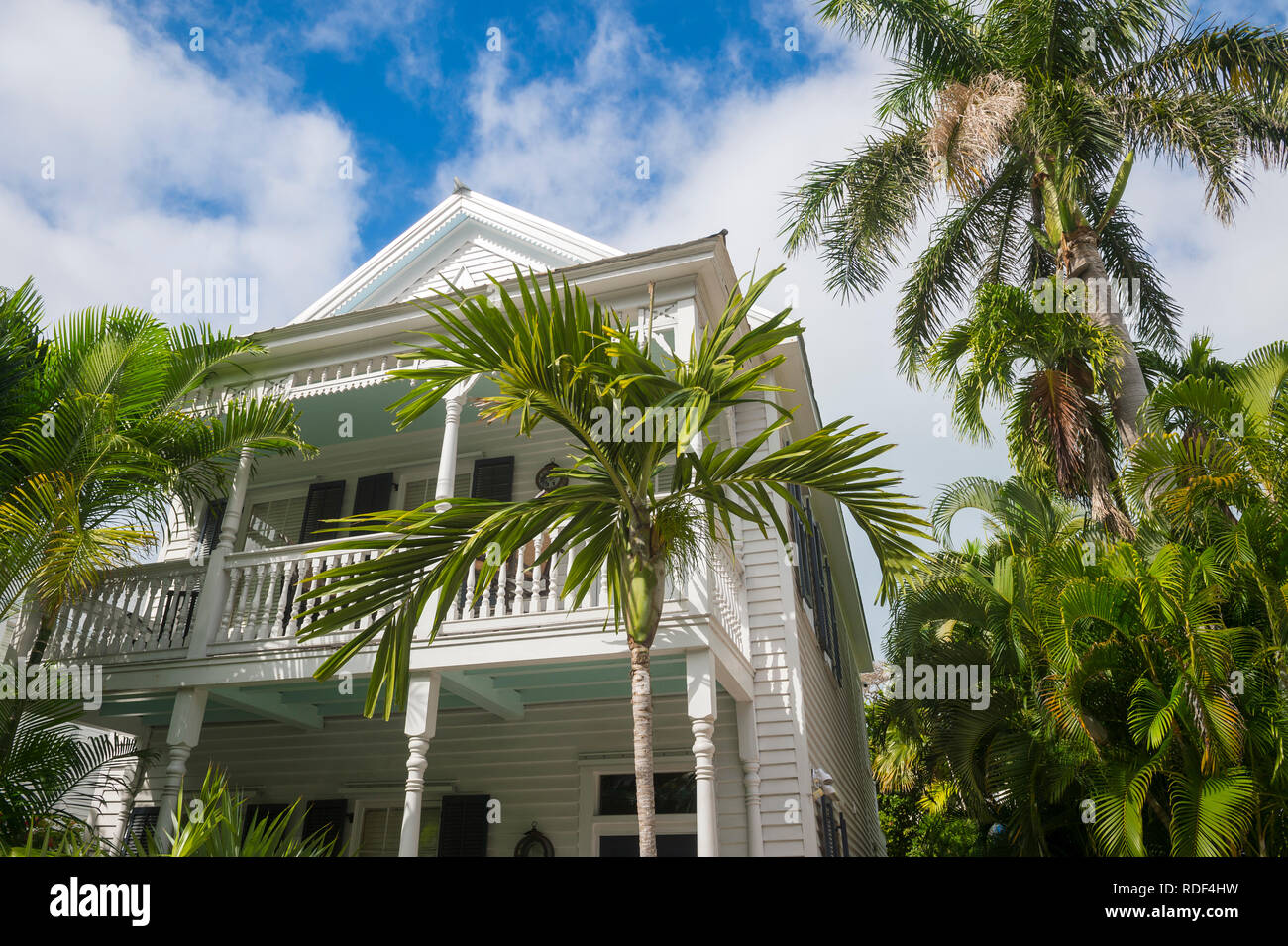 Bright scenic view of typical wooden conch house with patio overlooking