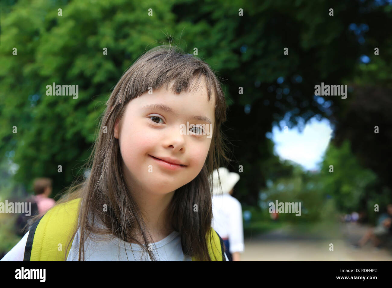 Portrait of little girl smiling in the park Stock Photo - Alamy