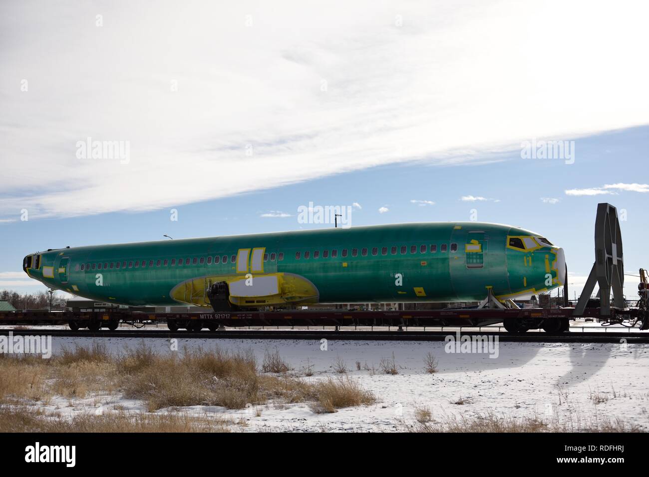 Newly manufactured Boeing 737 narrow body aircraft fuselage being transported by train to final assembly plant. Stock Photo