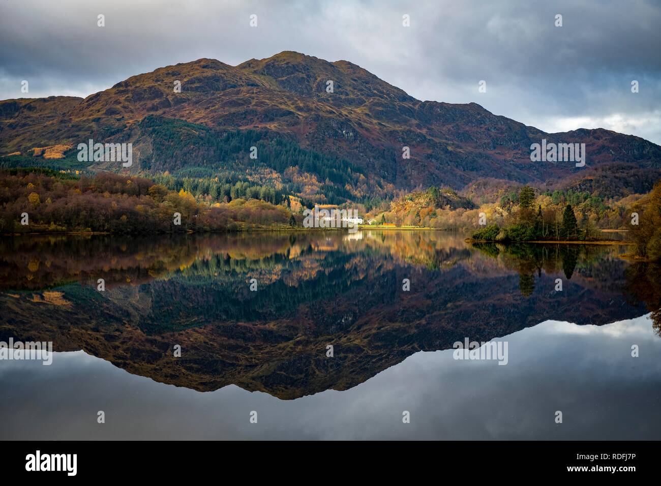 Reflection in Loch Katrine with Highlands, Trossachs National Park, Glasgow, Scotland, United Kingdom Stock Photo