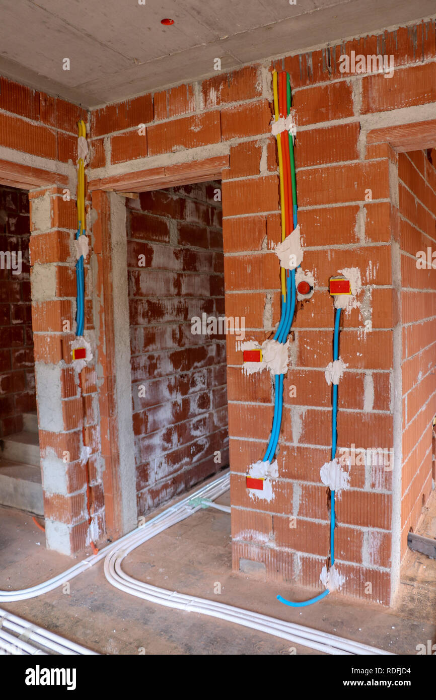 different color electrical installation in house Stock Photo - Alamy