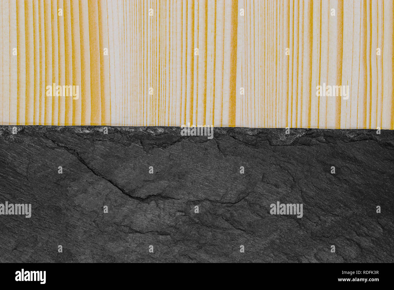 Abstract background composition of divided in the half striped wood plank and black stone with copy space Stock Photo