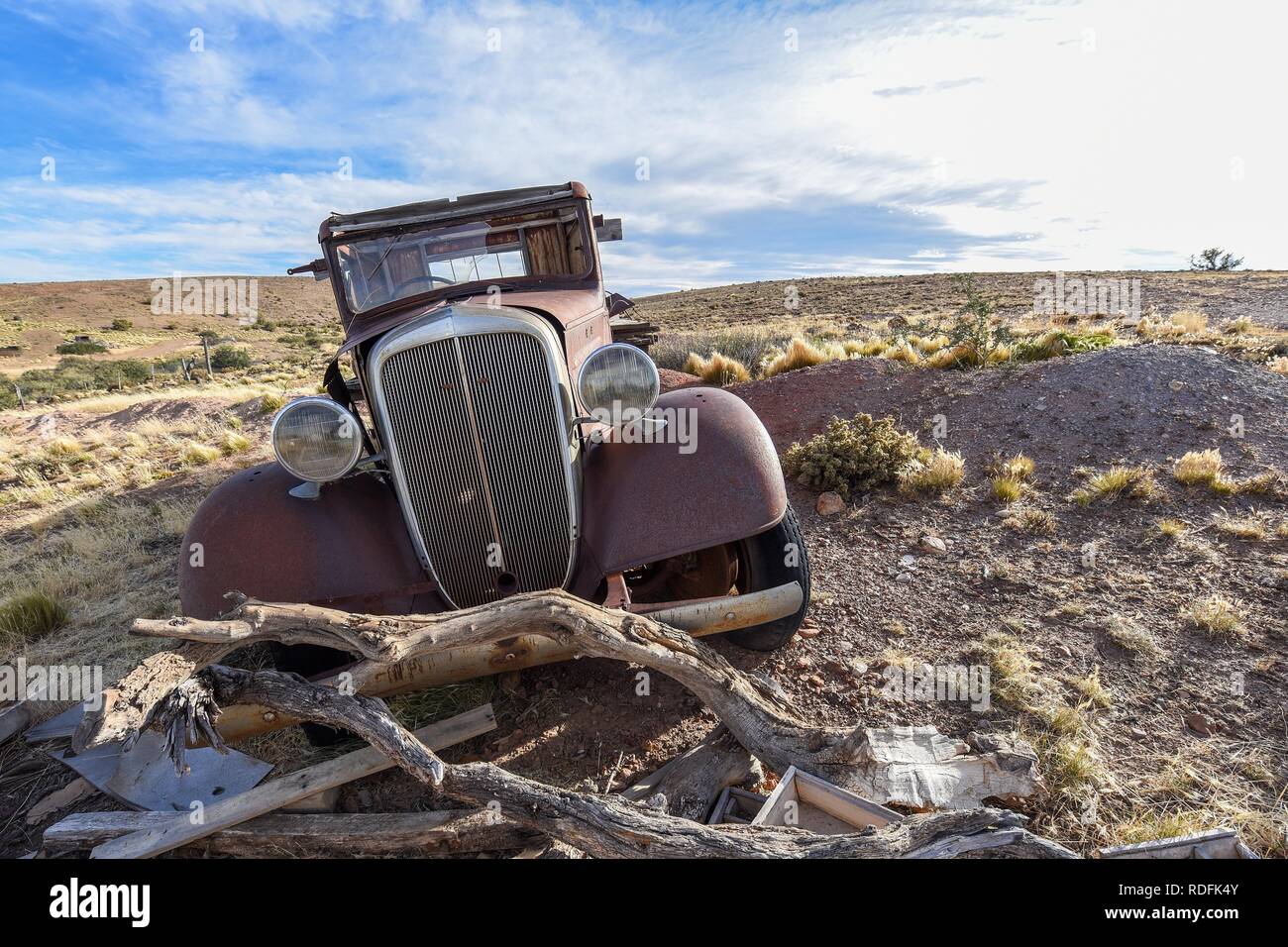 Pampa with old car on a farm in Bosques Petrificados de Jaramillo National Park, Patagonia, Argentina Stock Photo