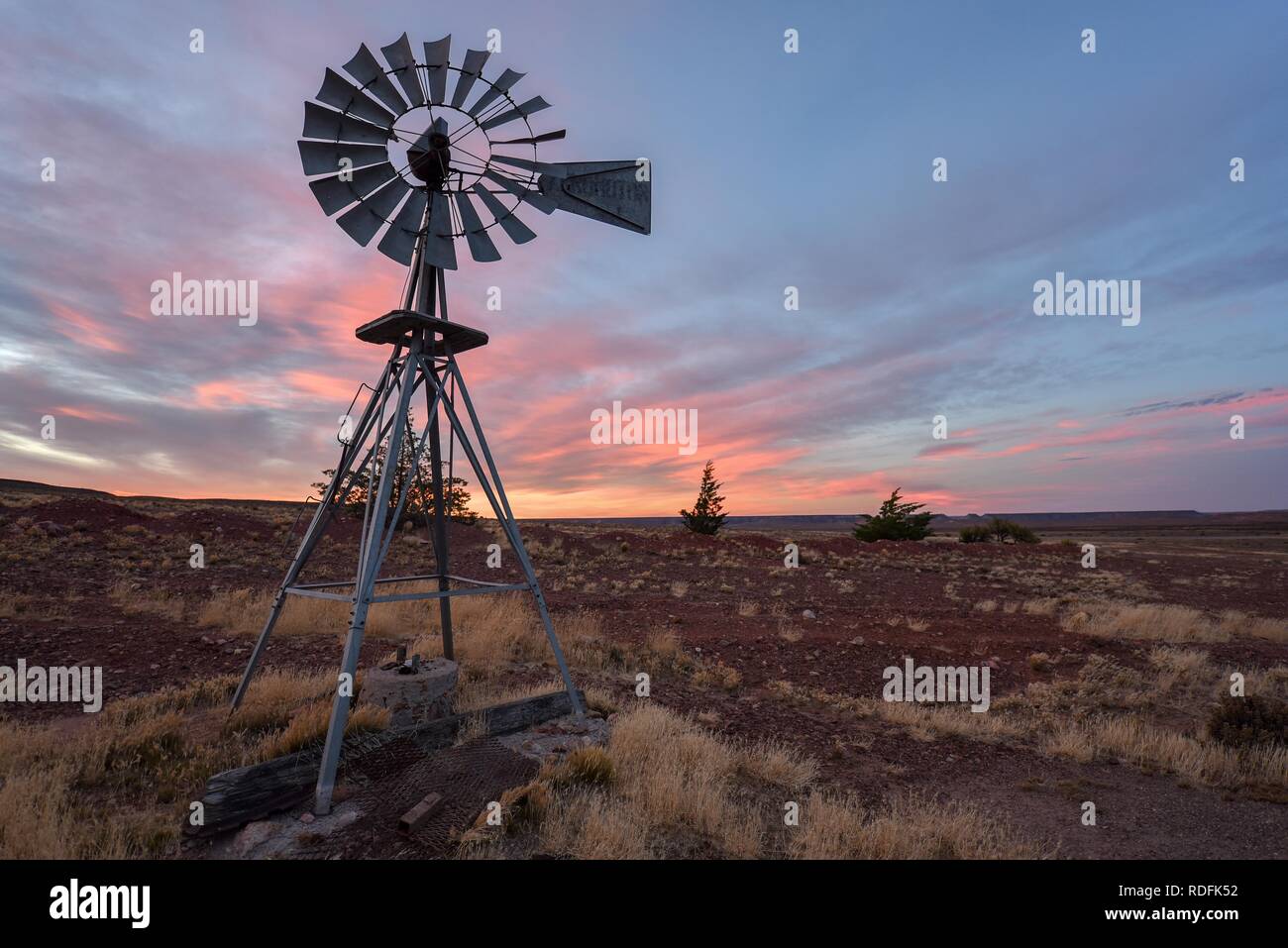 Pampa with old windmill on a farm in Bosques Petrificados de Jaramillo National Park, Patagonia, Argentina Stock Photo