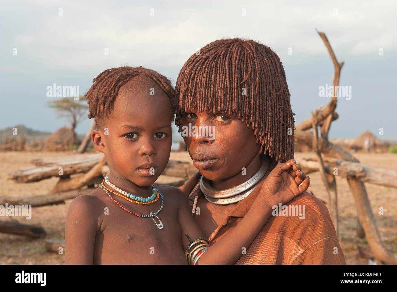 Young Hamar woman with traditional hairstyle with red clay in her hair and her child, Omo river valley, Southern Ethiopia Stock Photo - Alamy Young Hamar woman with traditional hairstyle with red clay in her hair and her child, Omo river valley, Southern Ethiopia Stock Photo - Alamy