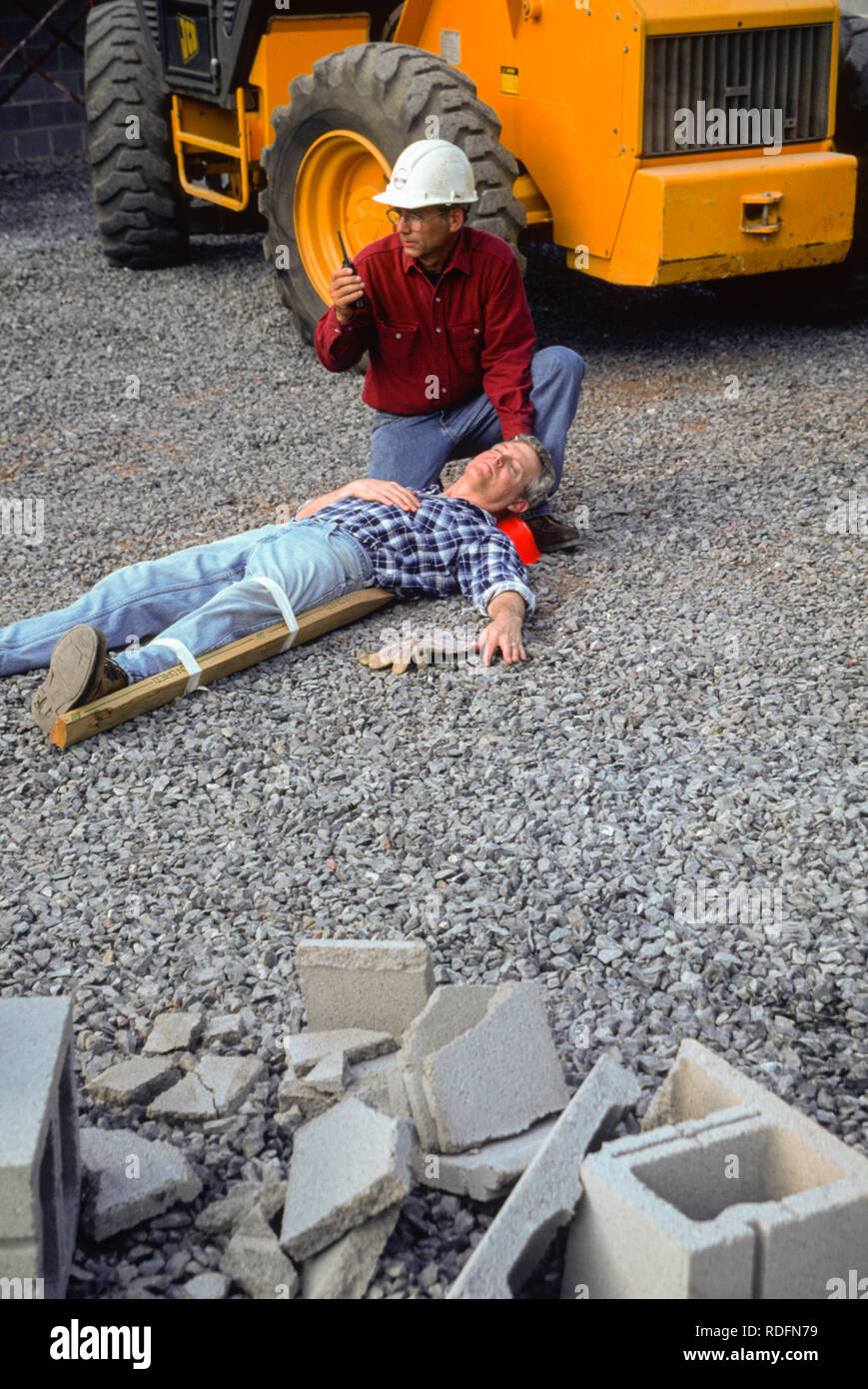 Industrial Accident and First Aid with Injured Tradesman, USA Stock