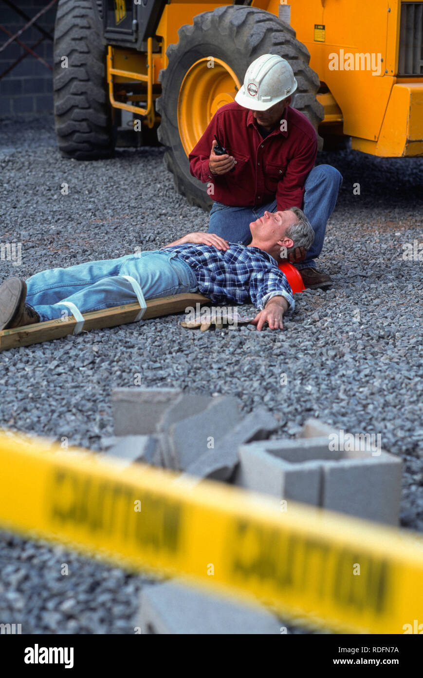 Industrial Accident and First Aid with Injured Tradesman, USA Stock