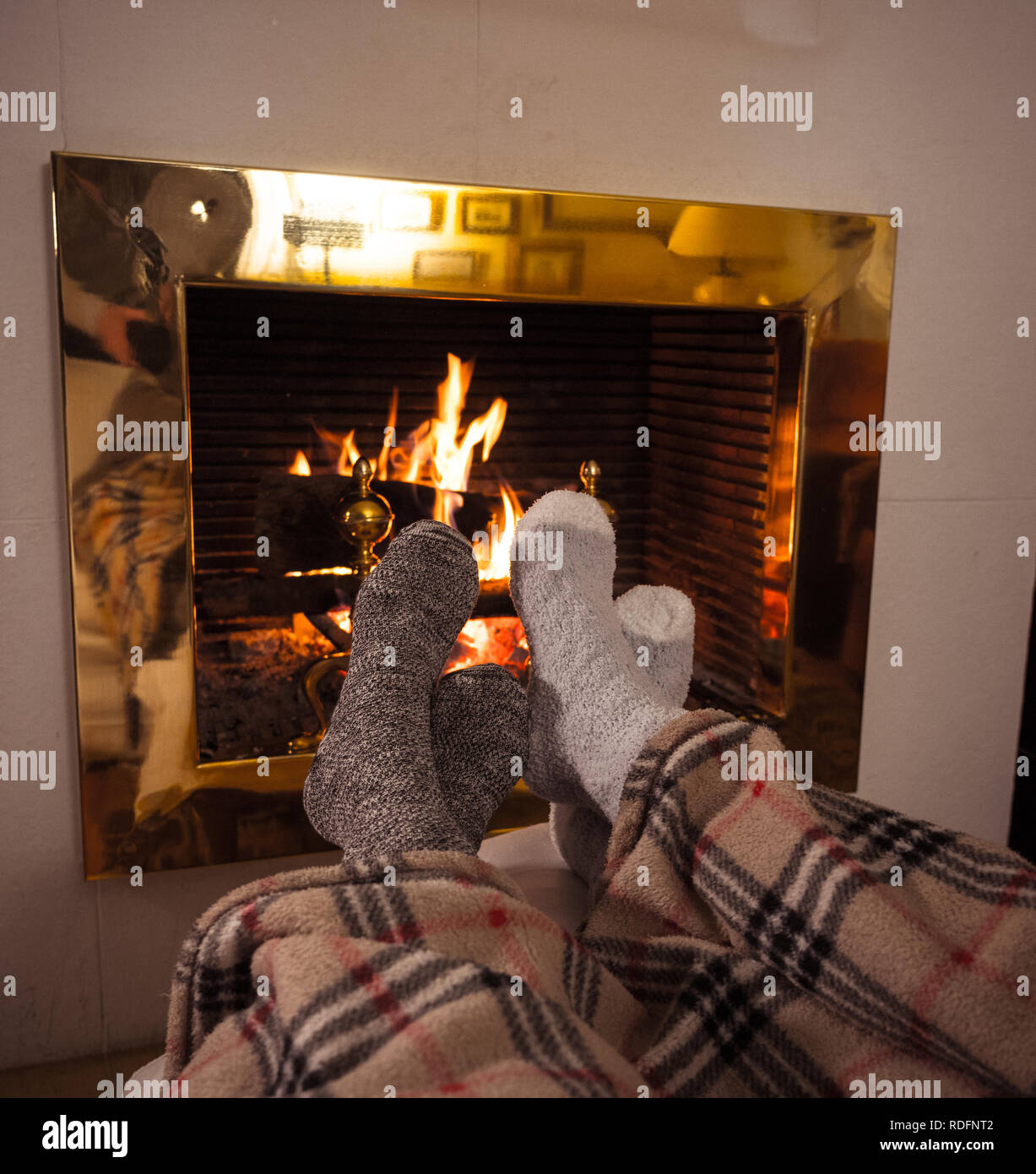 Close Up Image Of Couple Sitting Under The Blanket By Cozy