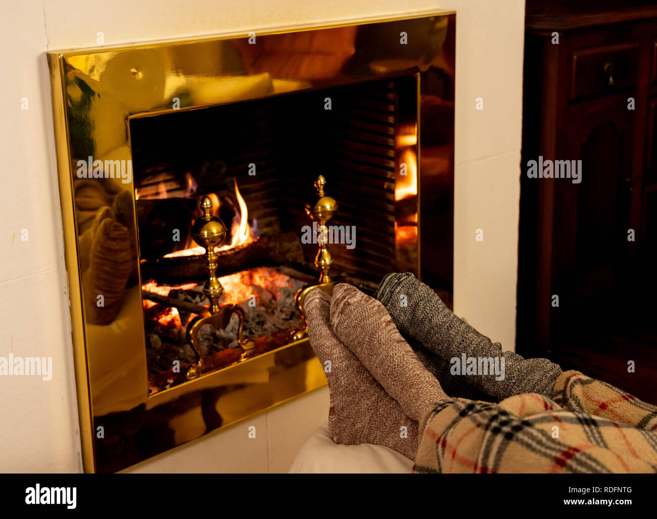 Close Up Image Of Couple Sitting Under The Blanket By Cozy