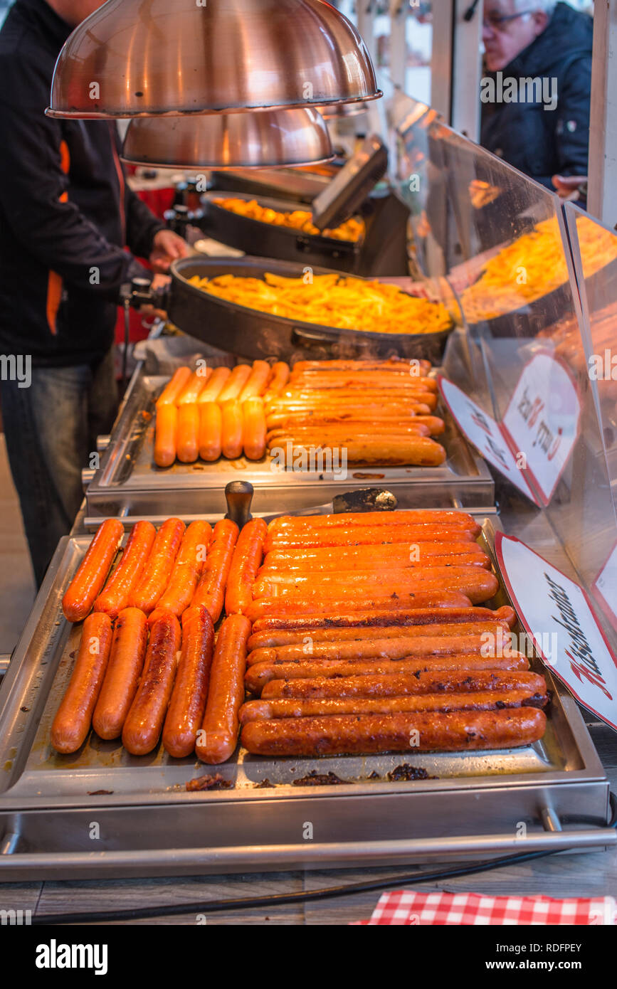 German sausages on sale at street stall at Christmas market in Vienna city centre, Austria. Stock Photo