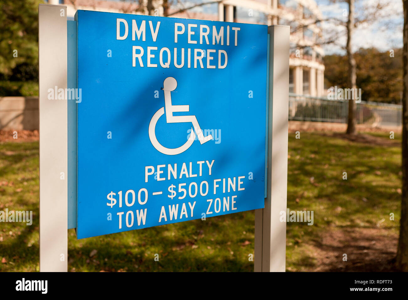 Handicapped parking sign (disabled parking sign) with warning for penalty - USA Stock Photo