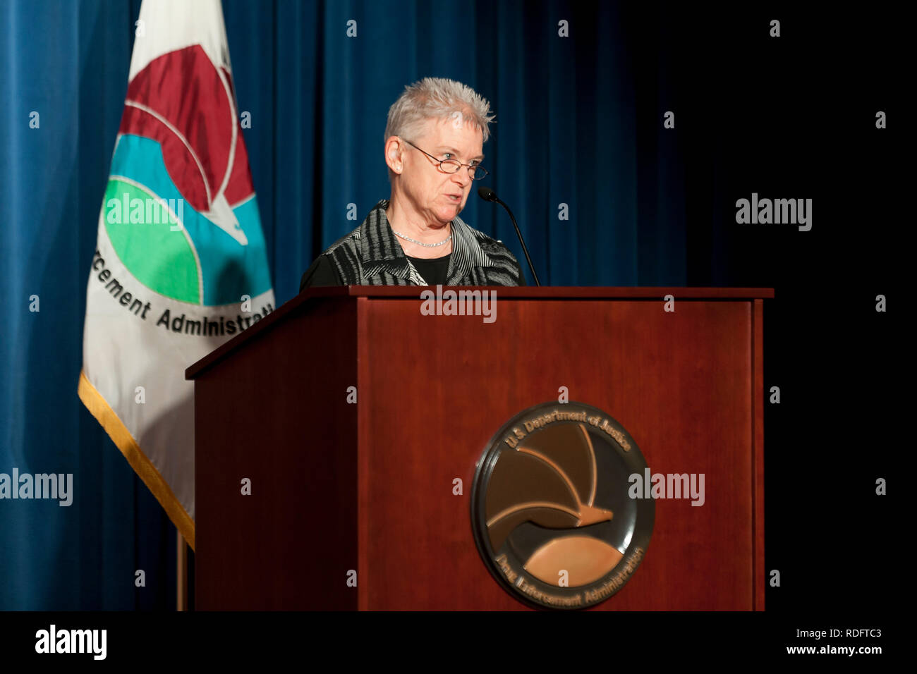 Elizabeth L. Maurer, Curator of Education for the DEA Museum, speaking at lectern - USA Stock Photo