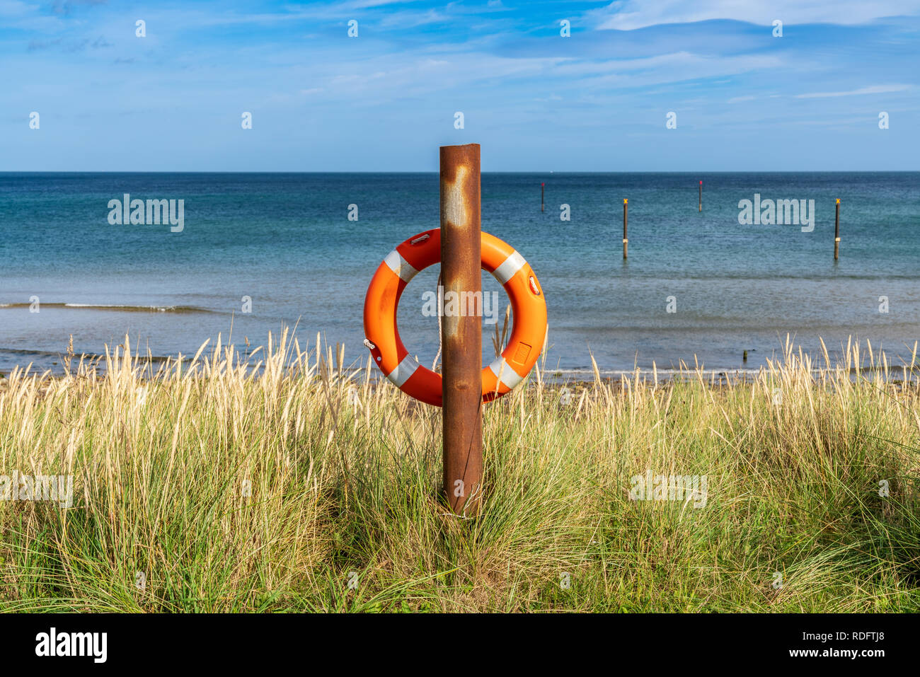Lifebuoy at the Coast of North Beach in Cambois near Blyth, Northumberland, England, UK Stock Photo