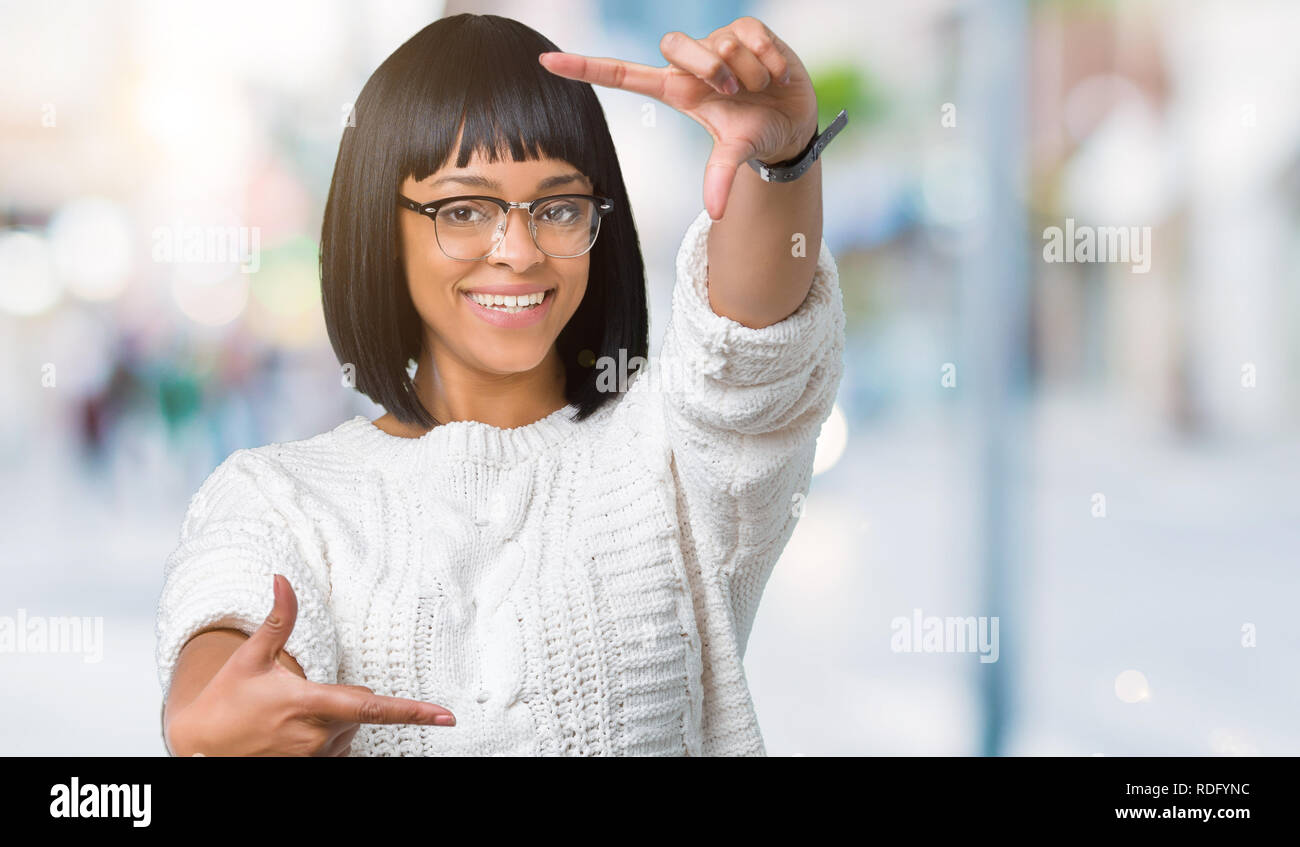 Beautiful young african american woman wearing glasses over isolated ...