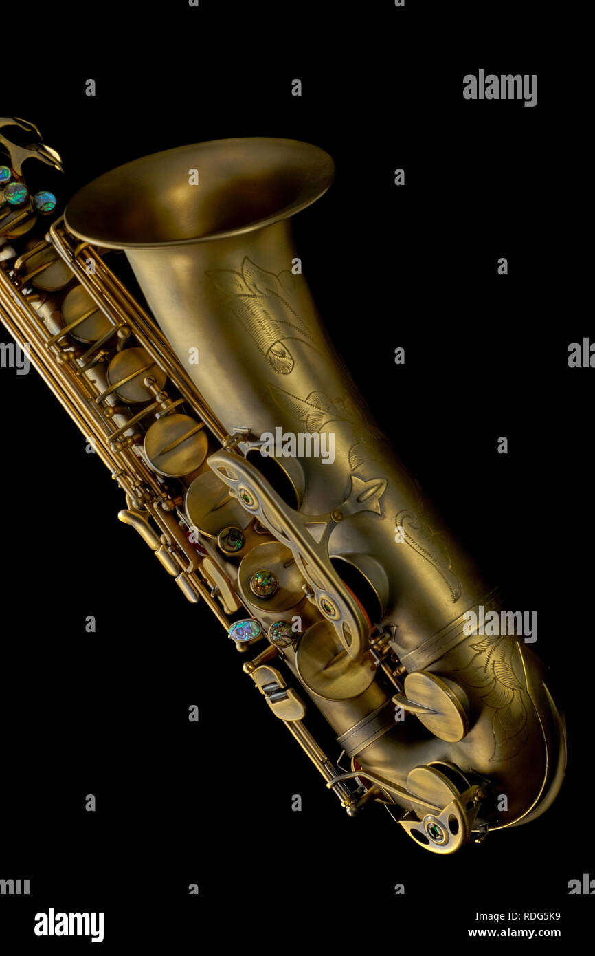 Closeup of high quality saxophone isolated on black background Stock Photo