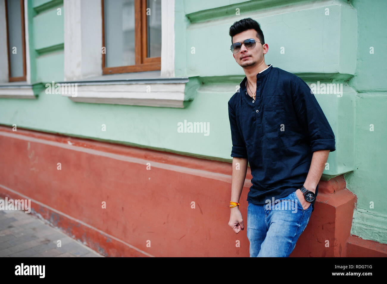 black shirt blue jeans men