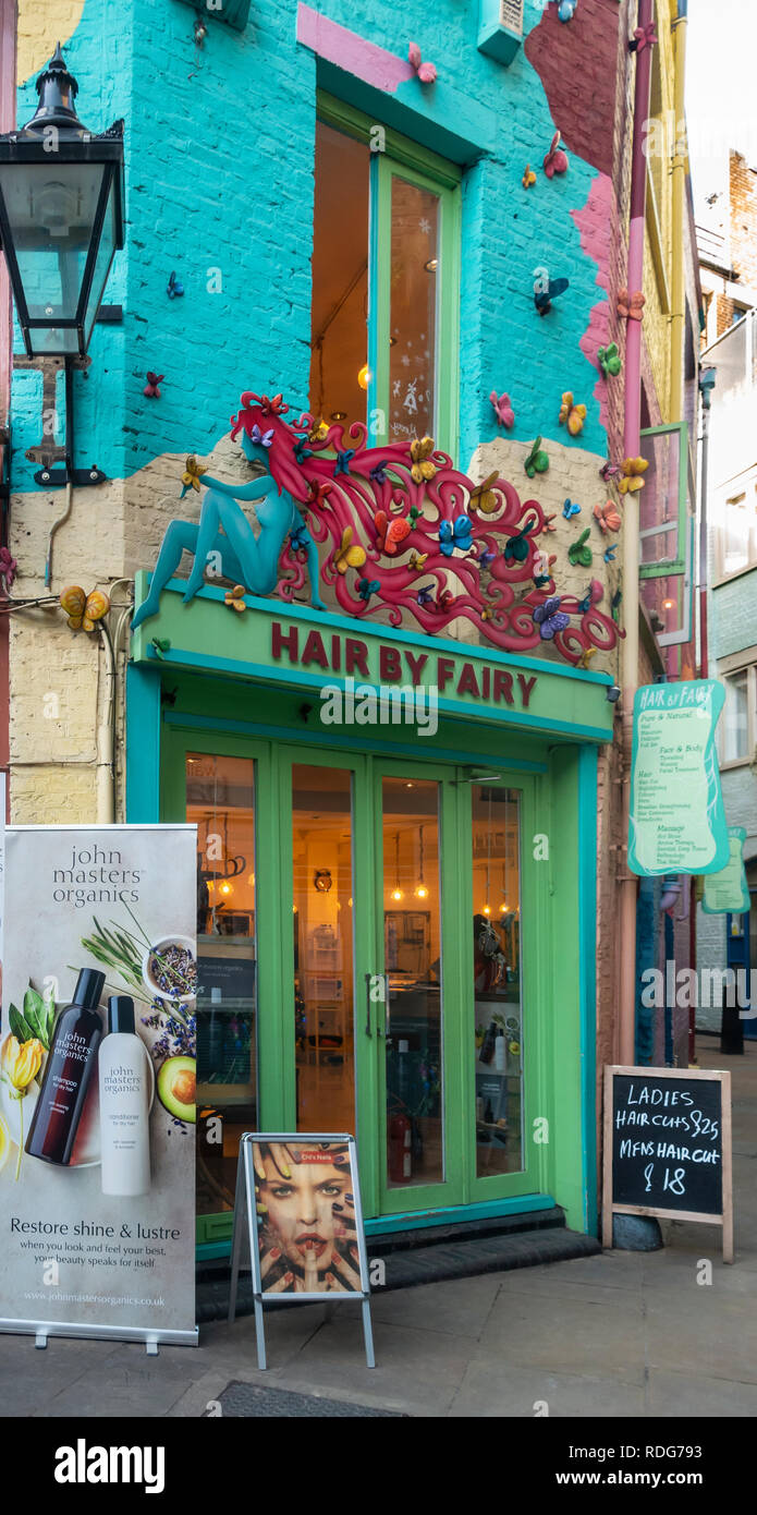 Colourful exterior of, and entrance to Hair by Fairy, a hair and beauty salon in Neal's Yard in Covent Garden, London, Englan d. Stock Photo