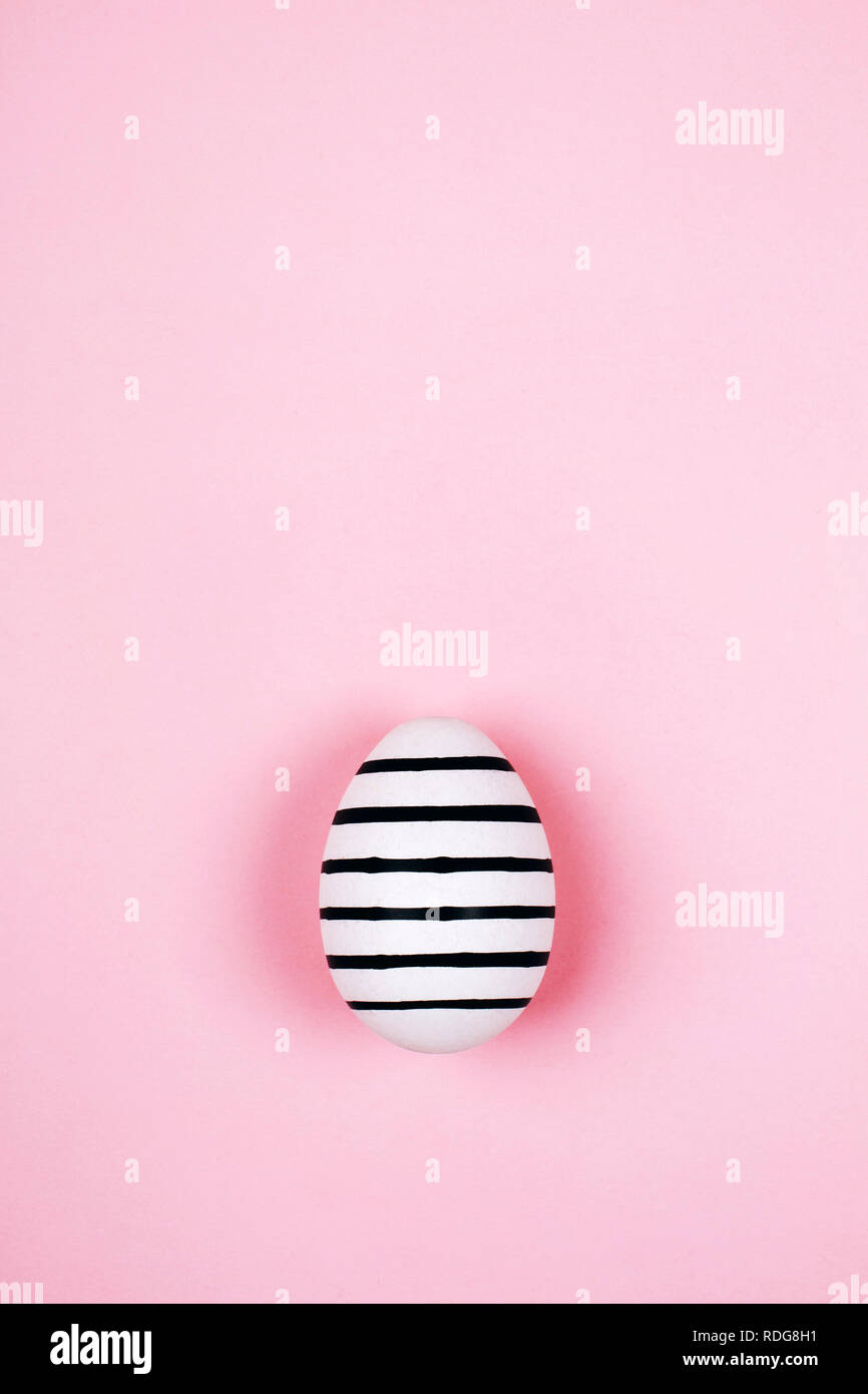 Easter egg on trendy pink pastel background. Flat lay style Stock Photo ...