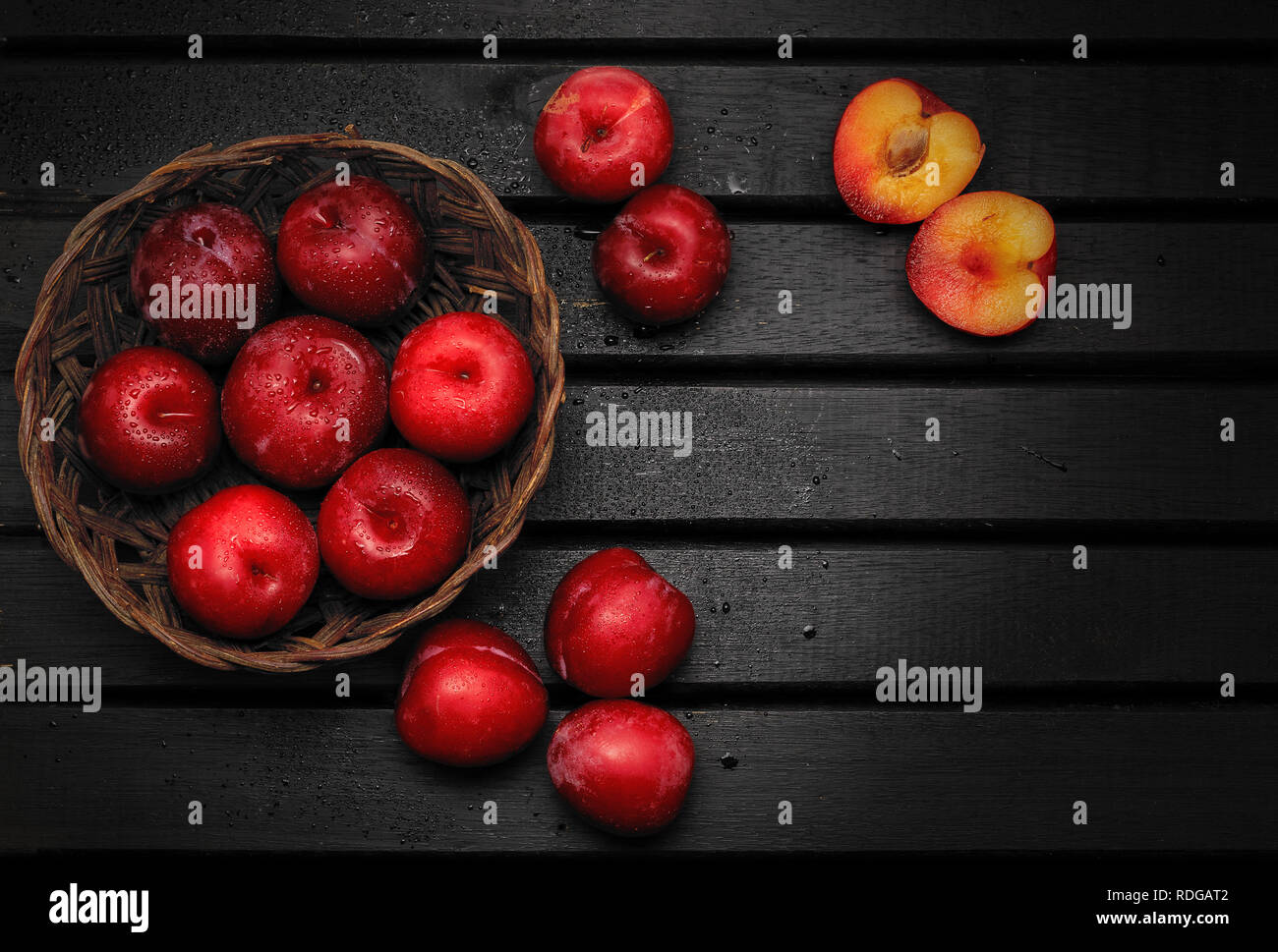 Red and delicious Plum fuits on top of a wooden table background Stock Photo