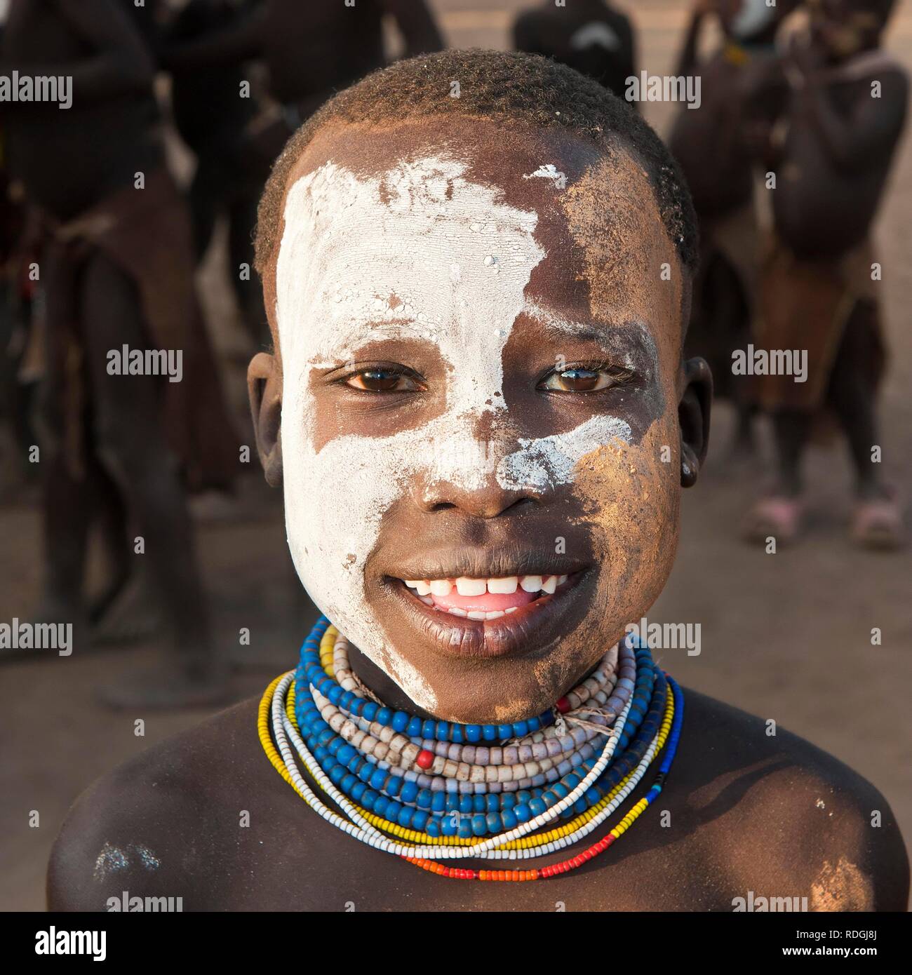 Karo boy with facial paintings and colorful necklaces, portrait, Omo river valley, Southern Ethiopia, Africa Stock Photo