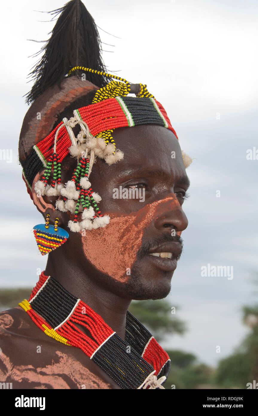 Portrait of a Karo man with body and facial paintings and a colorful headband, Omo river valley, Southern Ethiopia, Africa Stock Photo