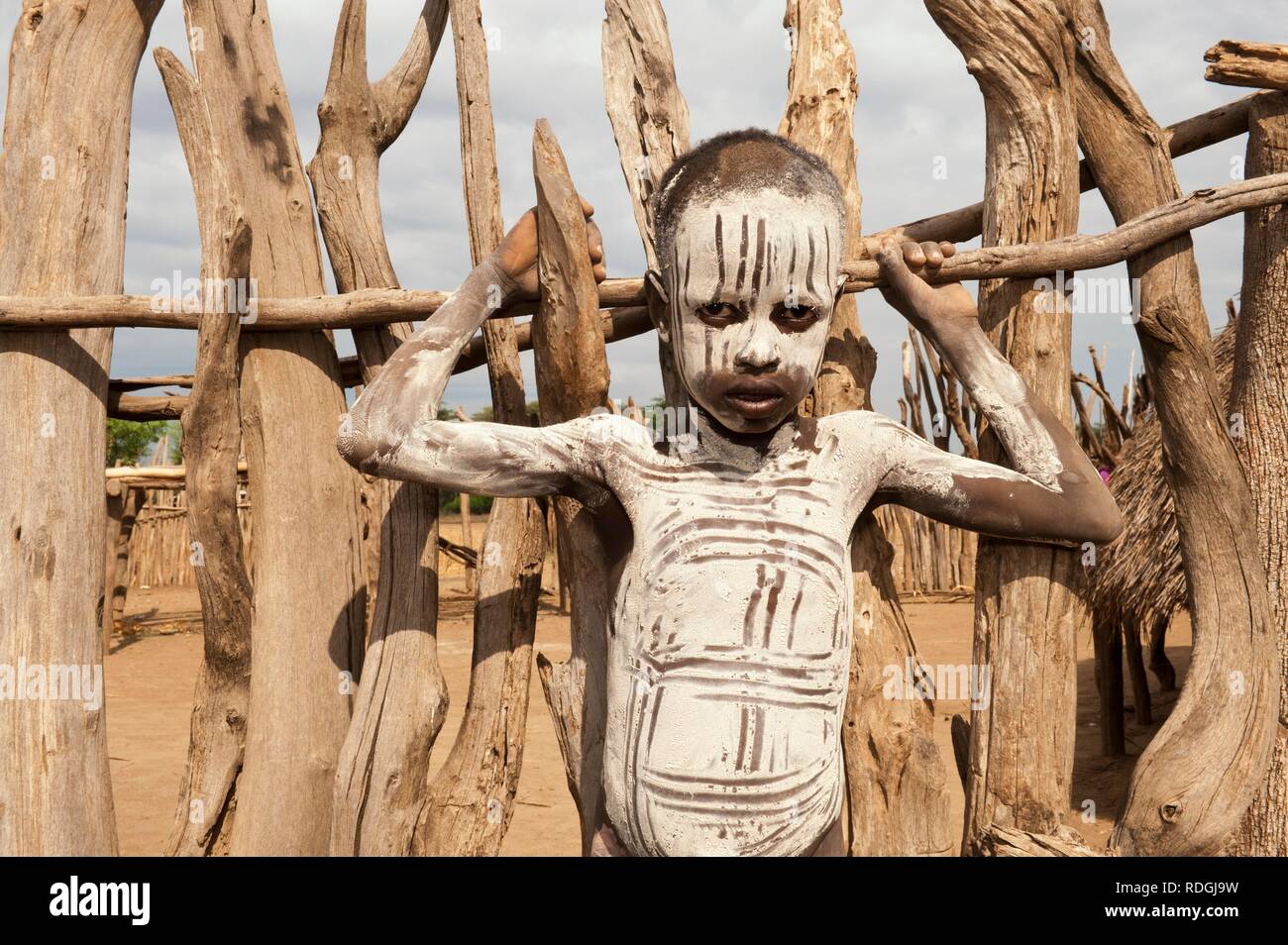 Karo boy with facial and body paintings, Omo river valley, Southern Ethiopia, Africa Stock Photo
