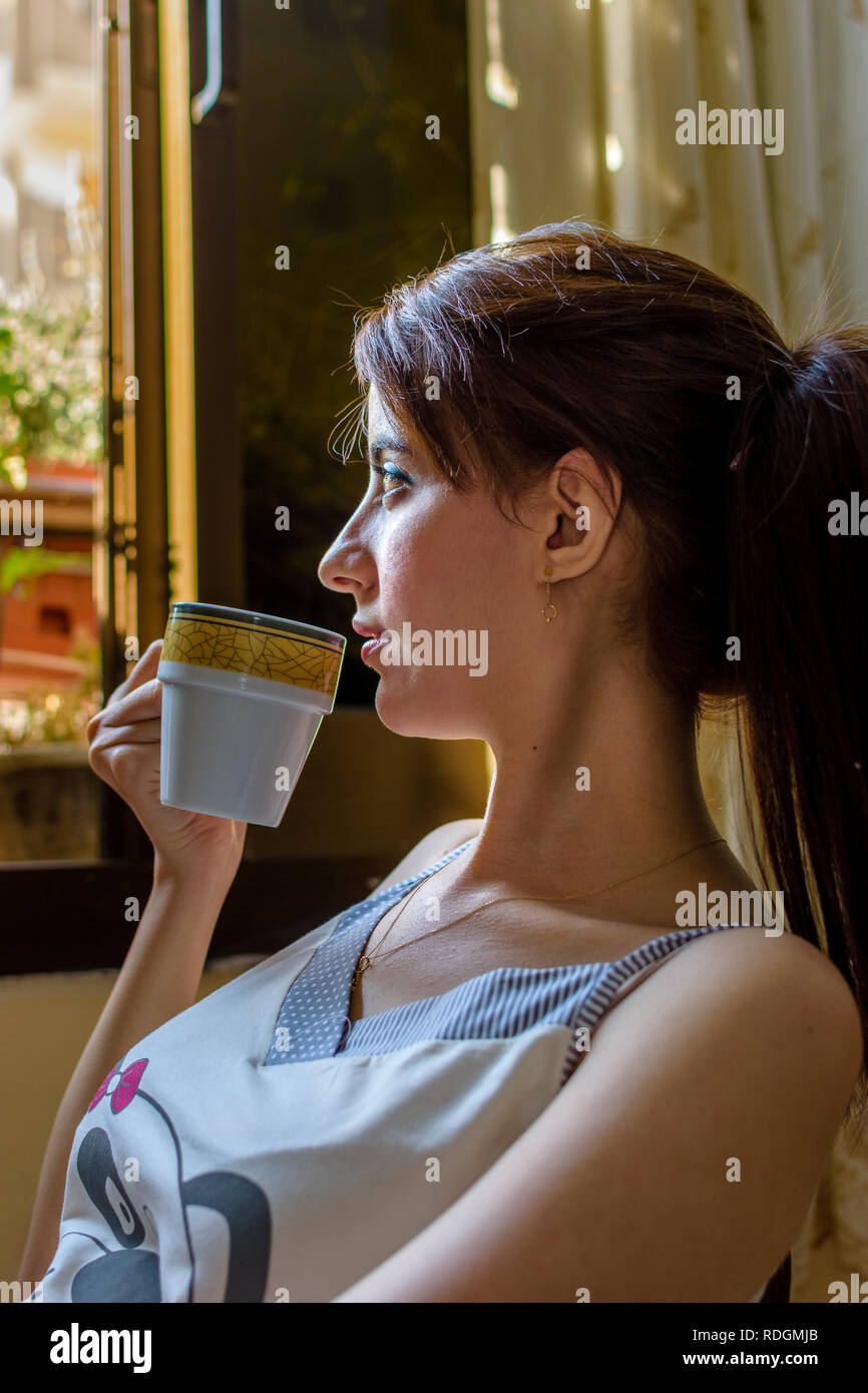 Arabian girl drinking coffee Stock Photo