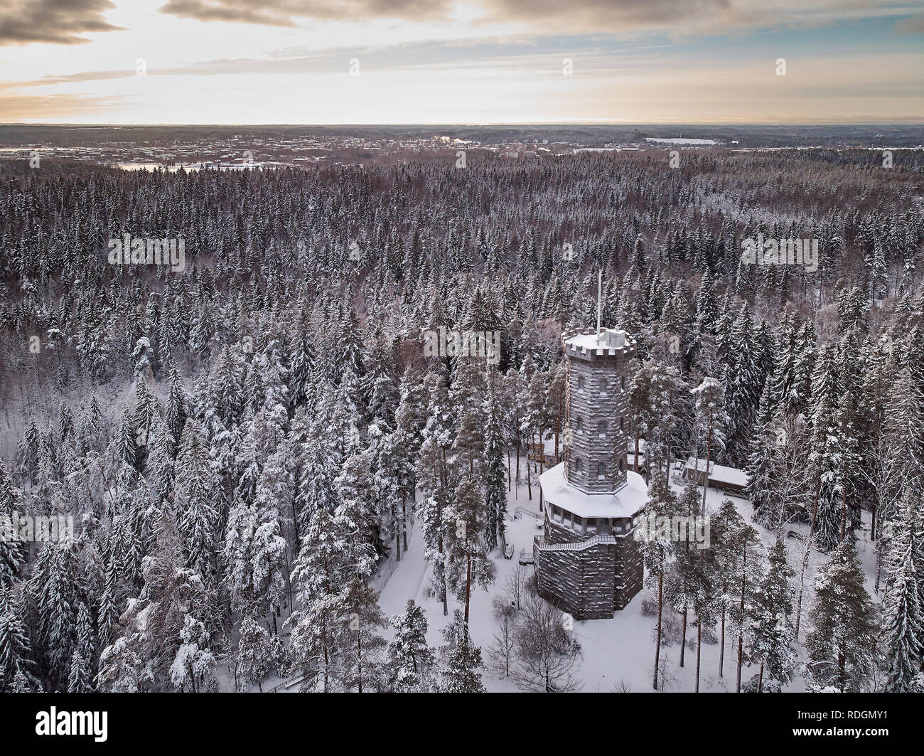 Aerial view of the lookout tower in winter landscape at Aulanko nature reserve park in Hämeenlinna, Finland. Frosty trees and snowy forest around an i Stock Photo