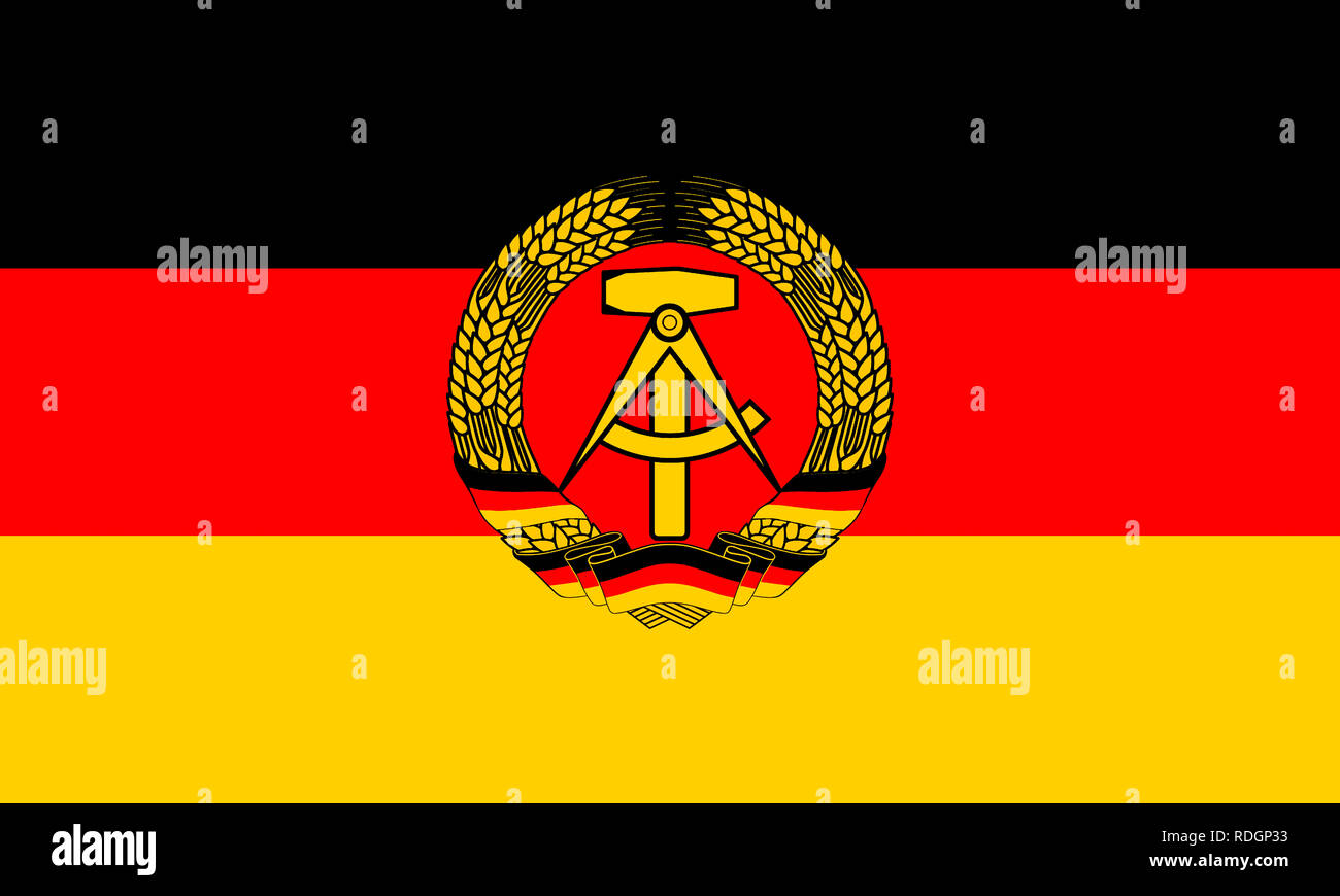 Flag of the German Democratic Republic with coat of arms Stock Photo