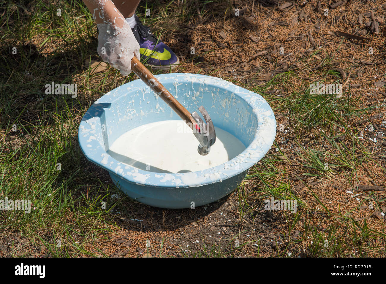 Oobleck, cornstarch and water, science experiment with person hammering