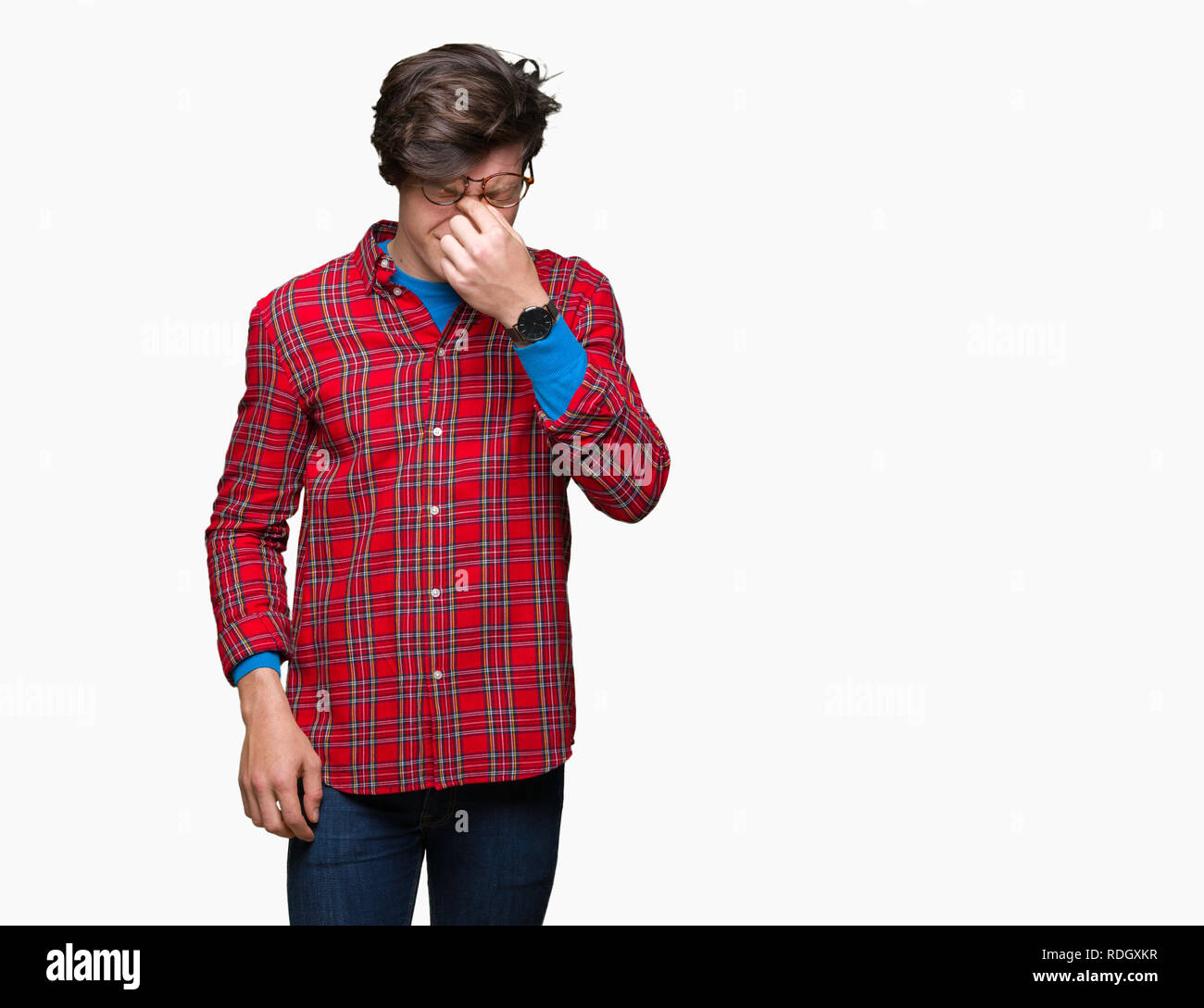 Young handsome man wearing glasses over isolated background tired