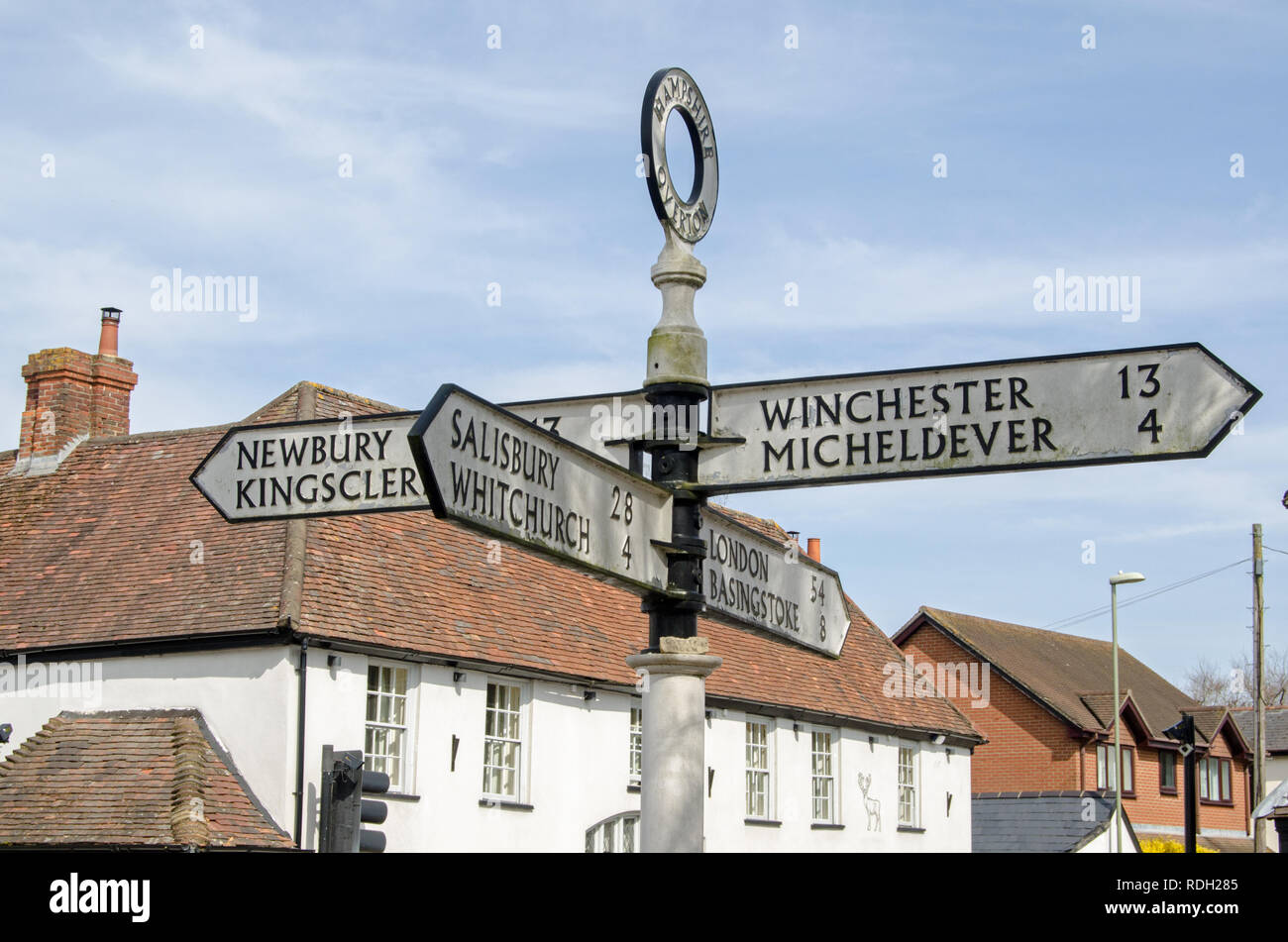 Finger post in the middle of the Hampshire town of Overton pointing towards the main towns and cities accessible from the now sleepy area. Stock Photo