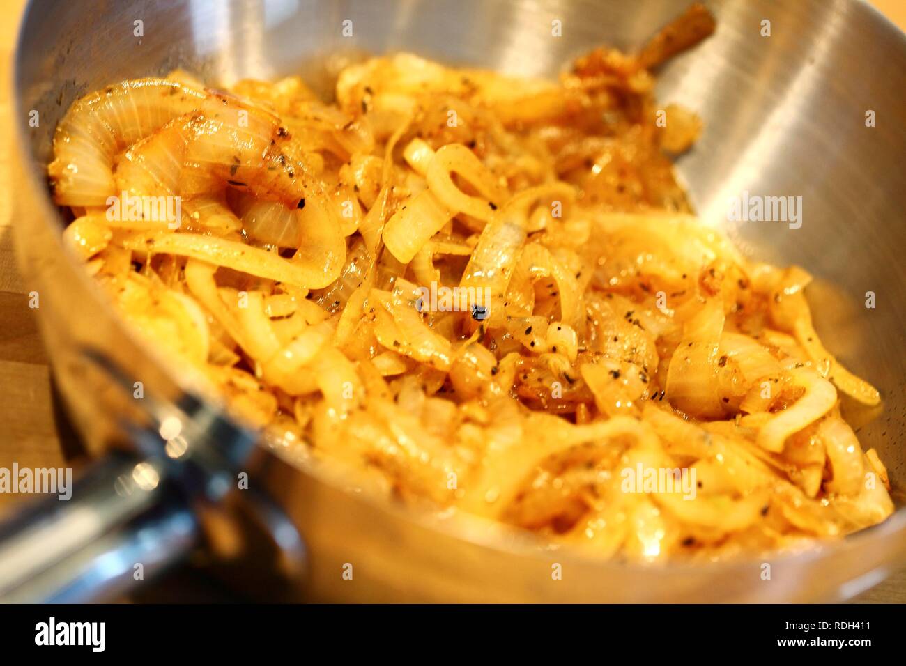 Braised onions in a sauté pan Stock Photo