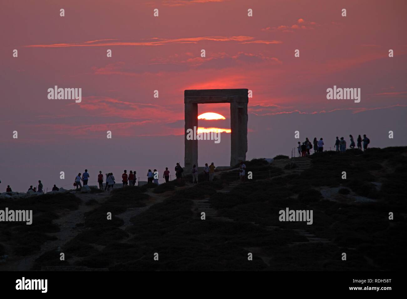 Sunset, Portara or gate of the Temple of Apollo, Naxos town, Naxos island, Cyclades, Aegean Sea, Greece, Europe Stock Photo